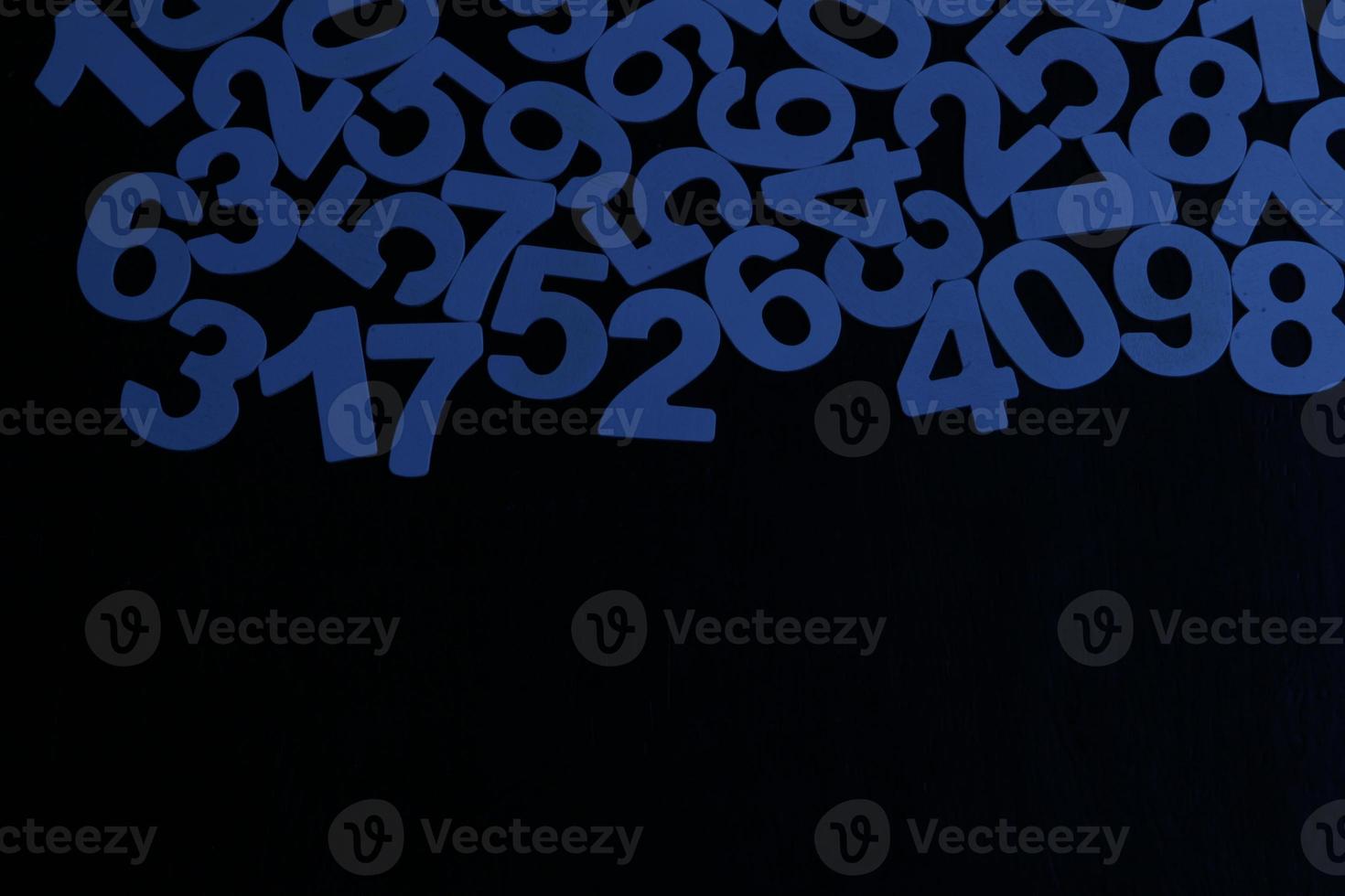 Colorful wooden numbers background. Numbers texture abstraction. Global economy crisis concept. Finance data pattern. photo