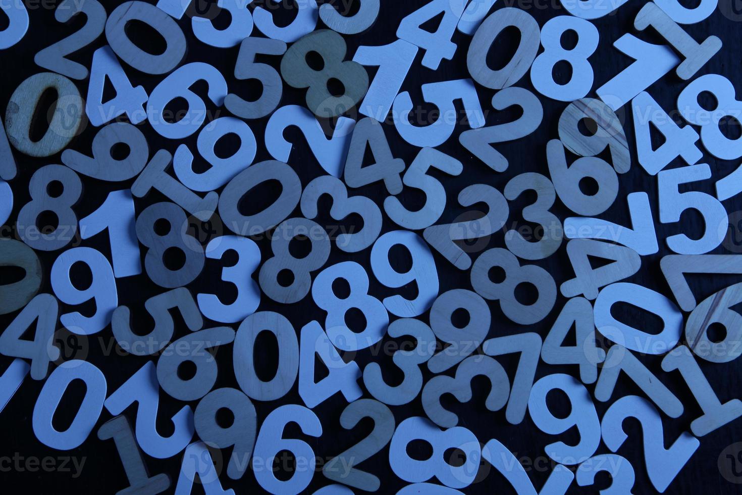 Colorful wooden numbers background. Numbers texture abstraction. Global economy crisis concept. Finance data pattern. photo