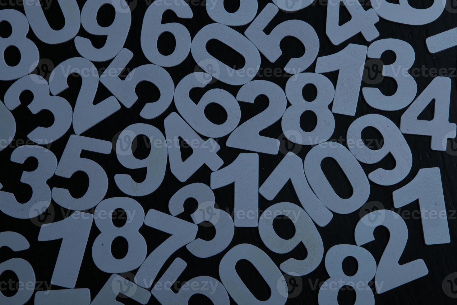 Colorful wooden numbers background. Numbers texture abstraction. Global economy crisis concept. Finance data pattern. photo