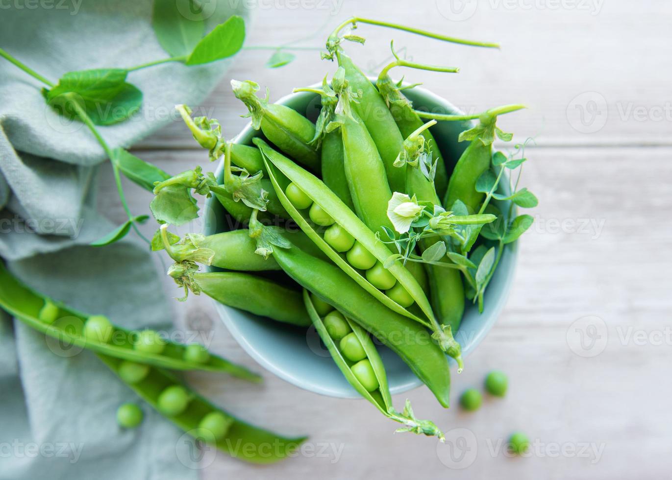 Bowl with sweet pea pods photo