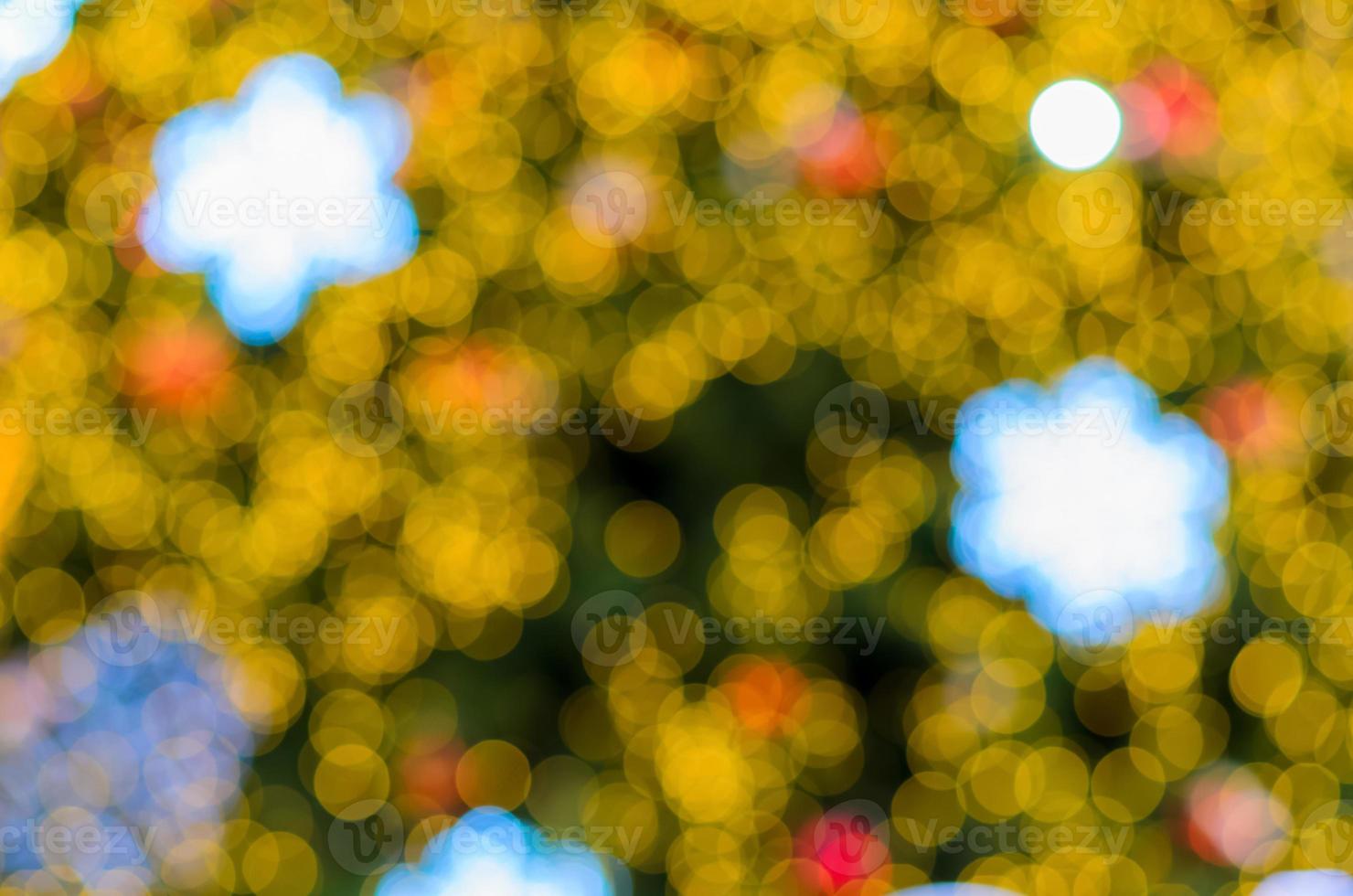 Blurred focus of colorful bokeh lights from Christmas tree for abstract and texture concept. photo