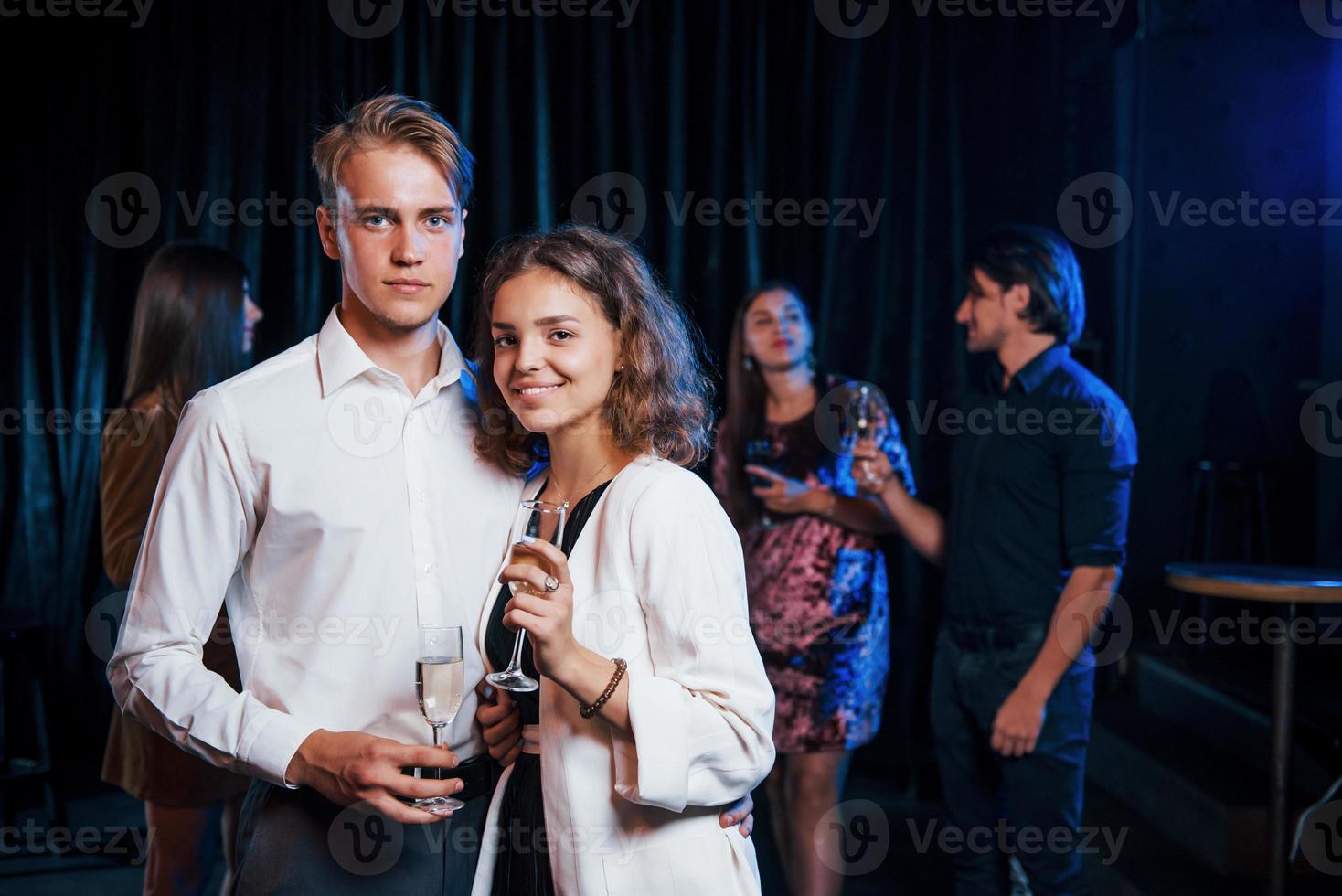 Portrait of lovely couple have party together with their friends photo