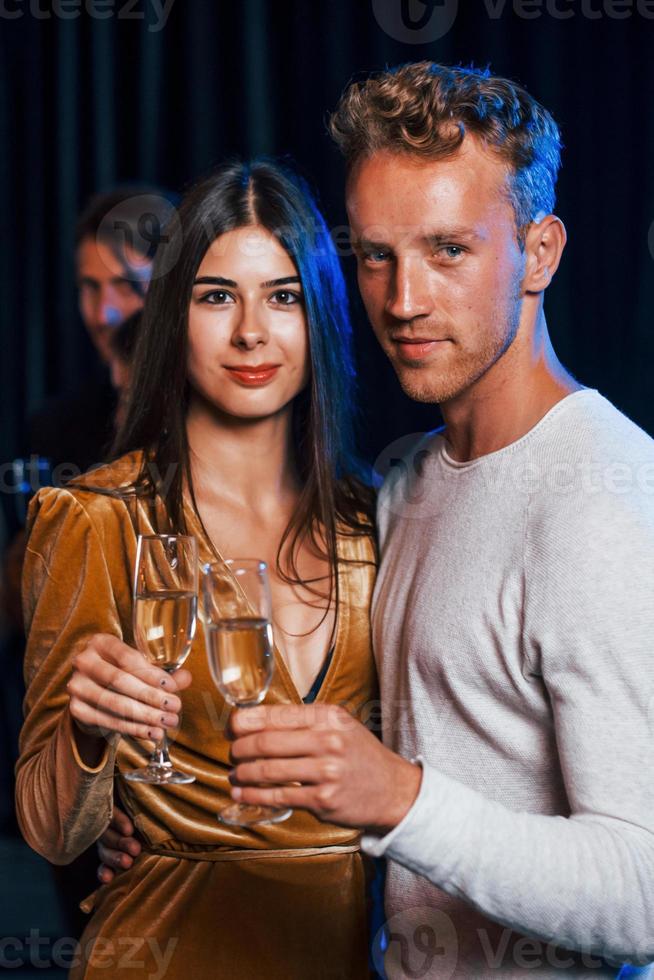 Portrait of lovely couple have party together with their friends photo