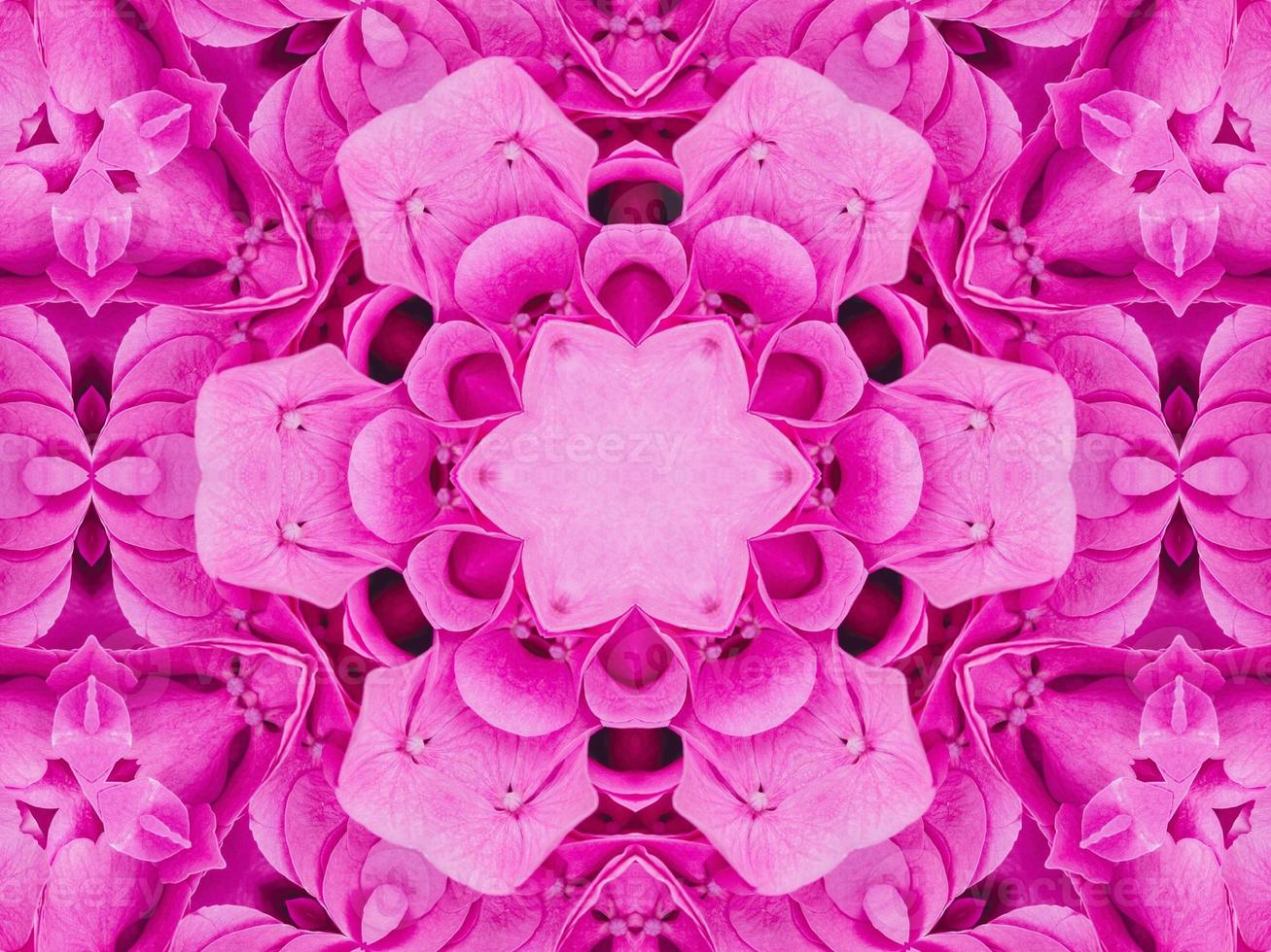 Magenta floral kaleidoscope pattern. Pink flower abstract unique and aesthetic background photo