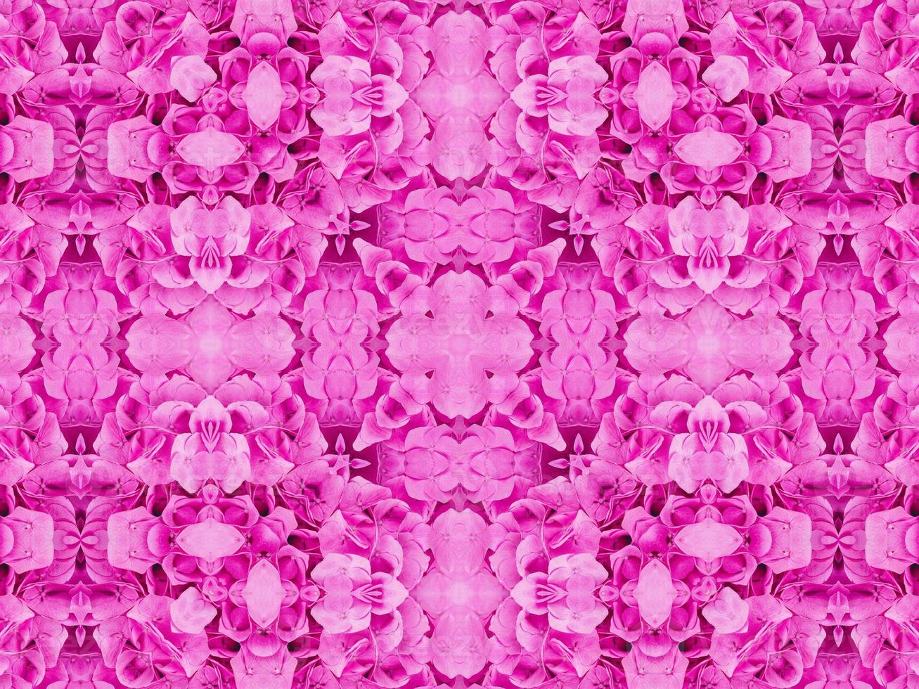 Magenta floral kaleidoscope pattern. Pink flower abstract unique and aesthetic background photo