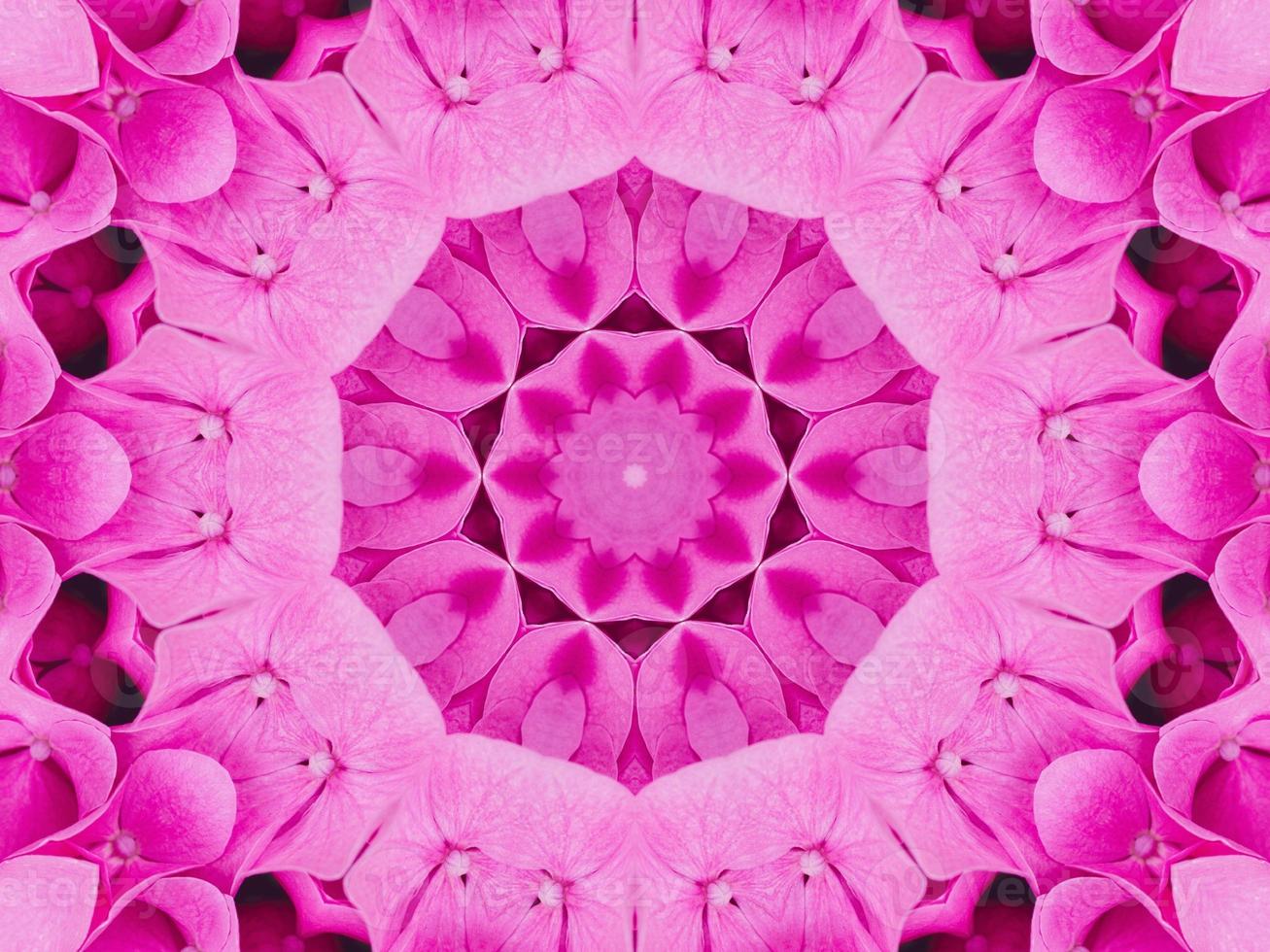 Magenta floral kaleidoscope pattern. Pink flower abstract unique and aesthetic background photo