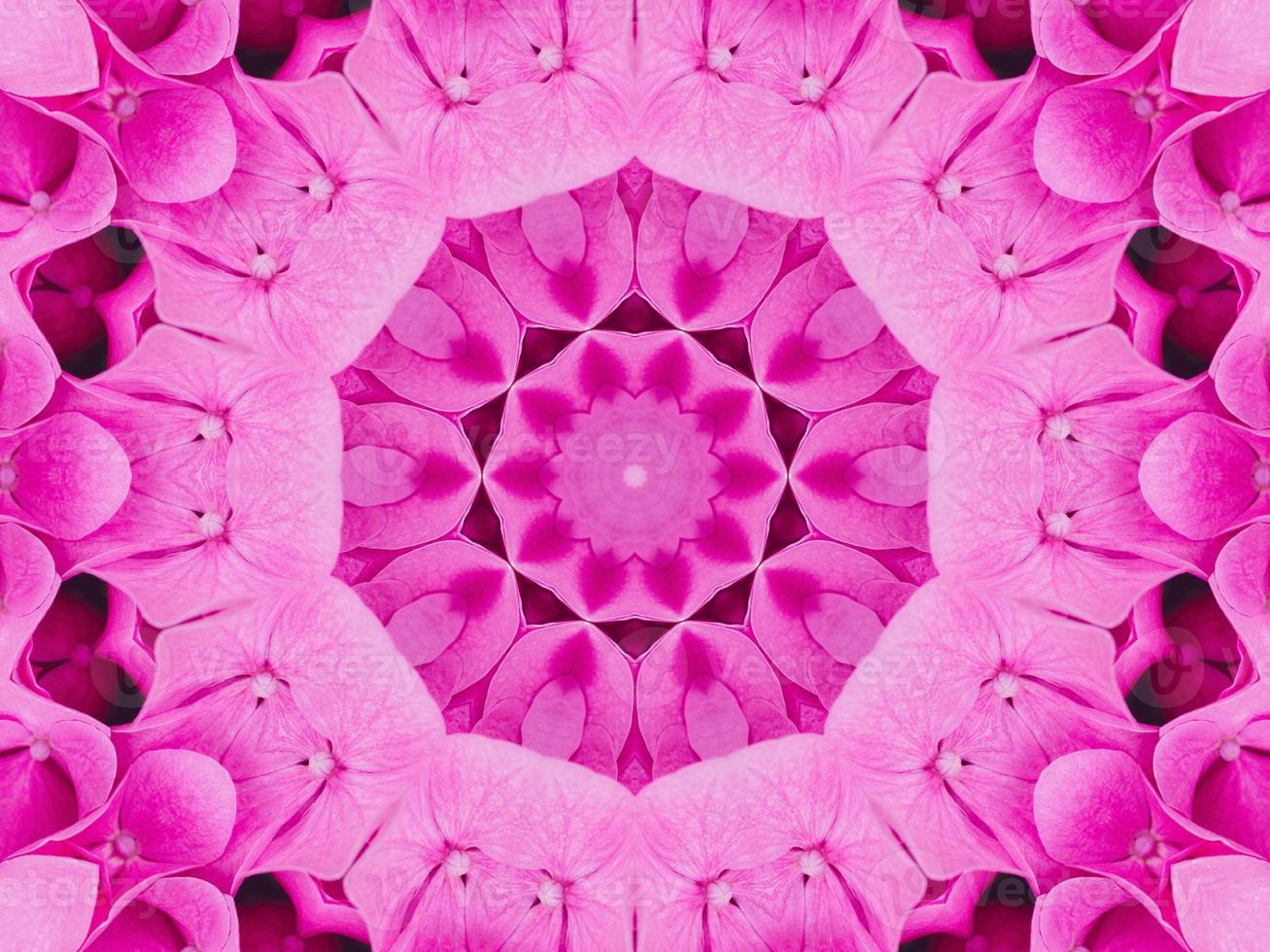 Magenta floral kaleidoscope pattern. Pink flower abstract unique and aesthetic background photo