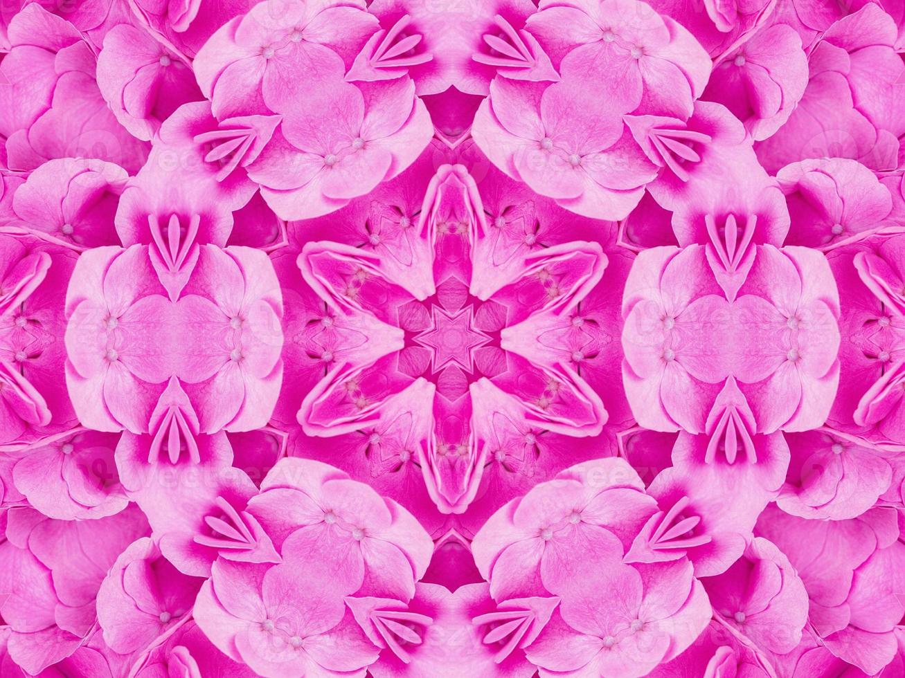 Magenta floral kaleidoscope pattern. Pink flower abstract unique and aesthetic background photo