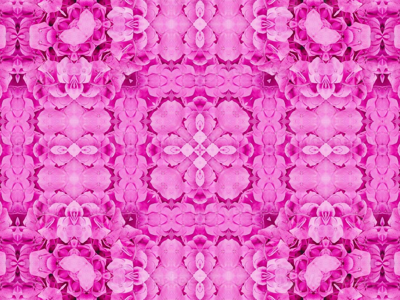 Magenta floral kaleidoscope pattern. Pink flower abstract unique and aesthetic background photo