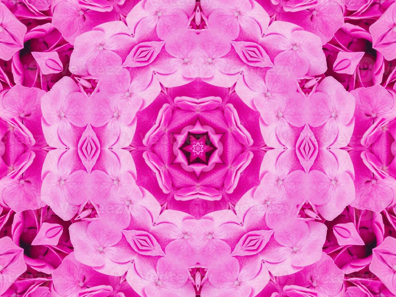 Magenta floral kaleidoscope pattern. Pink flower abstract unique and aesthetic background photo