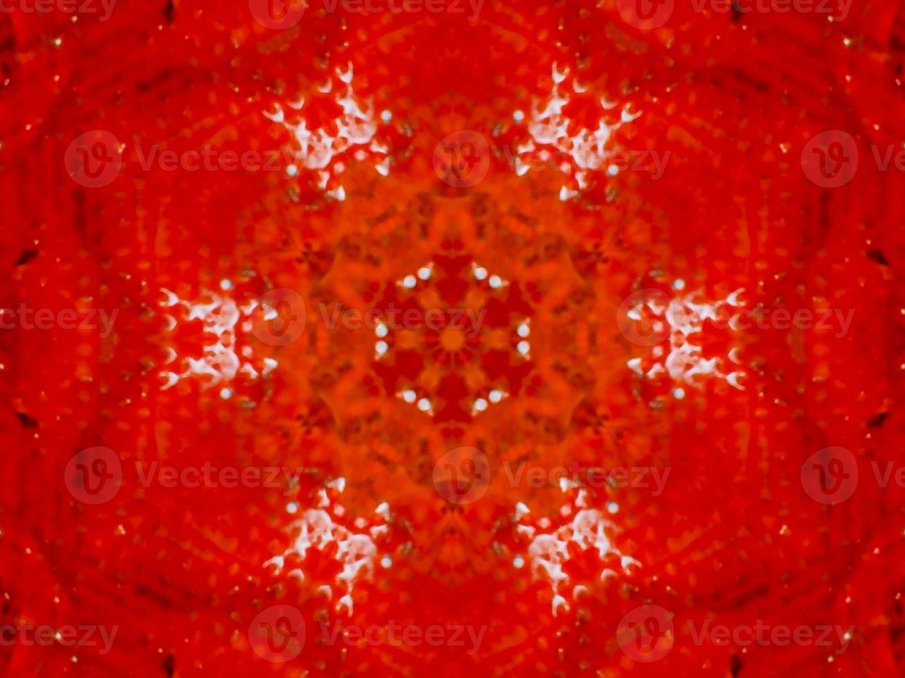 Colorful red fire kaleidoscope background abstract flower and symmetric pattern photo