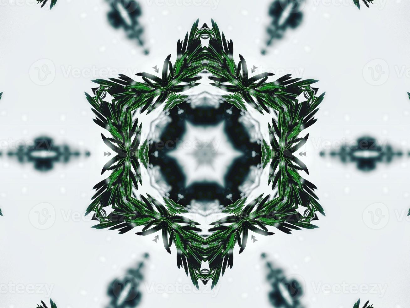 Blurry green leaves kaleidoscope background abstract flower and symmetric pattern for christmas vibes photo