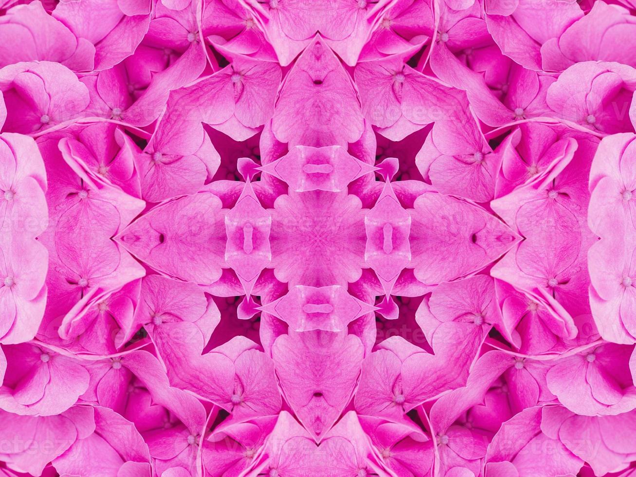 Magenta floral kaleidoscope pattern. Pink flower abstract unique and aesthetic background photo