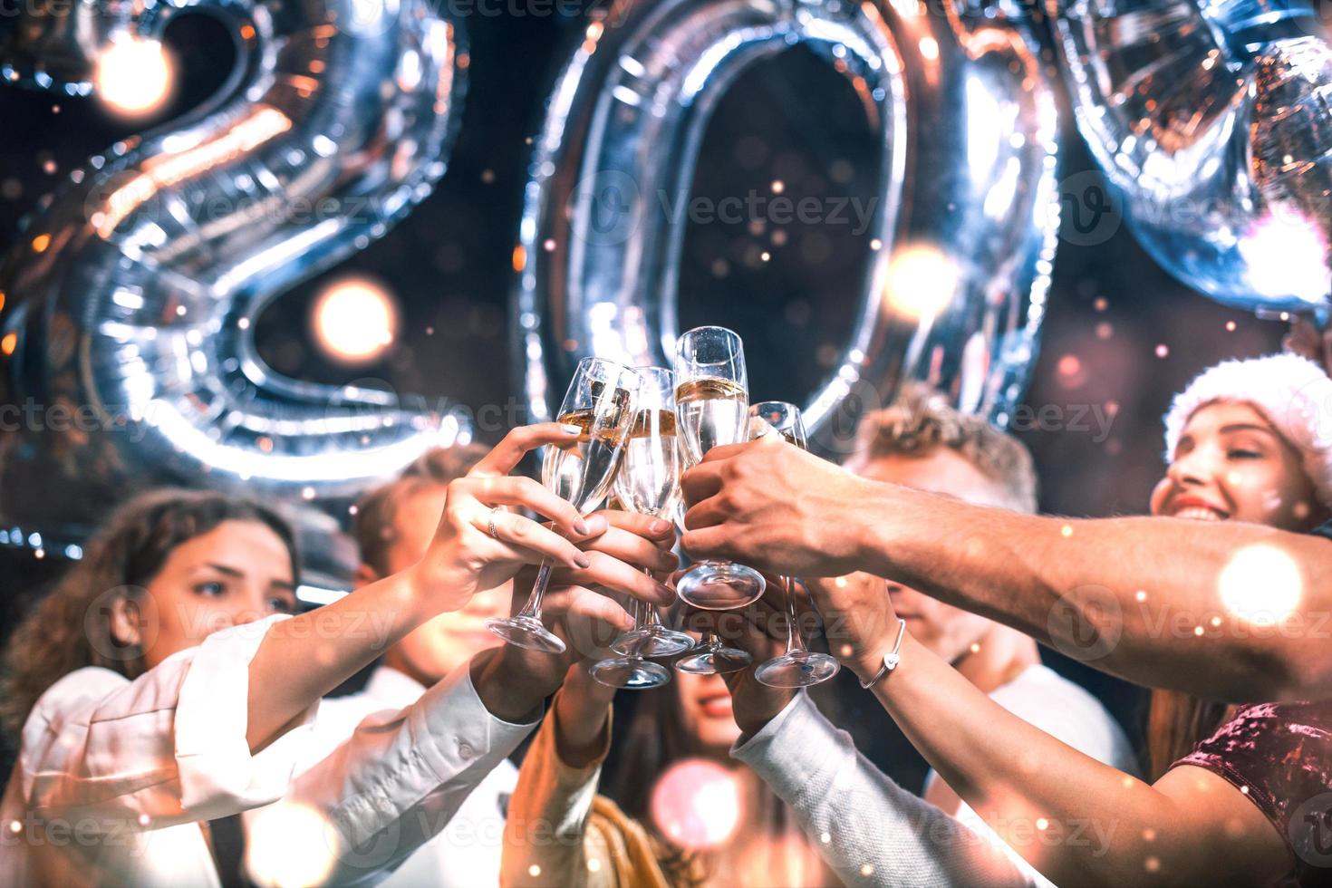 Positive young people holds balloons with new 202 year and celebrating photo