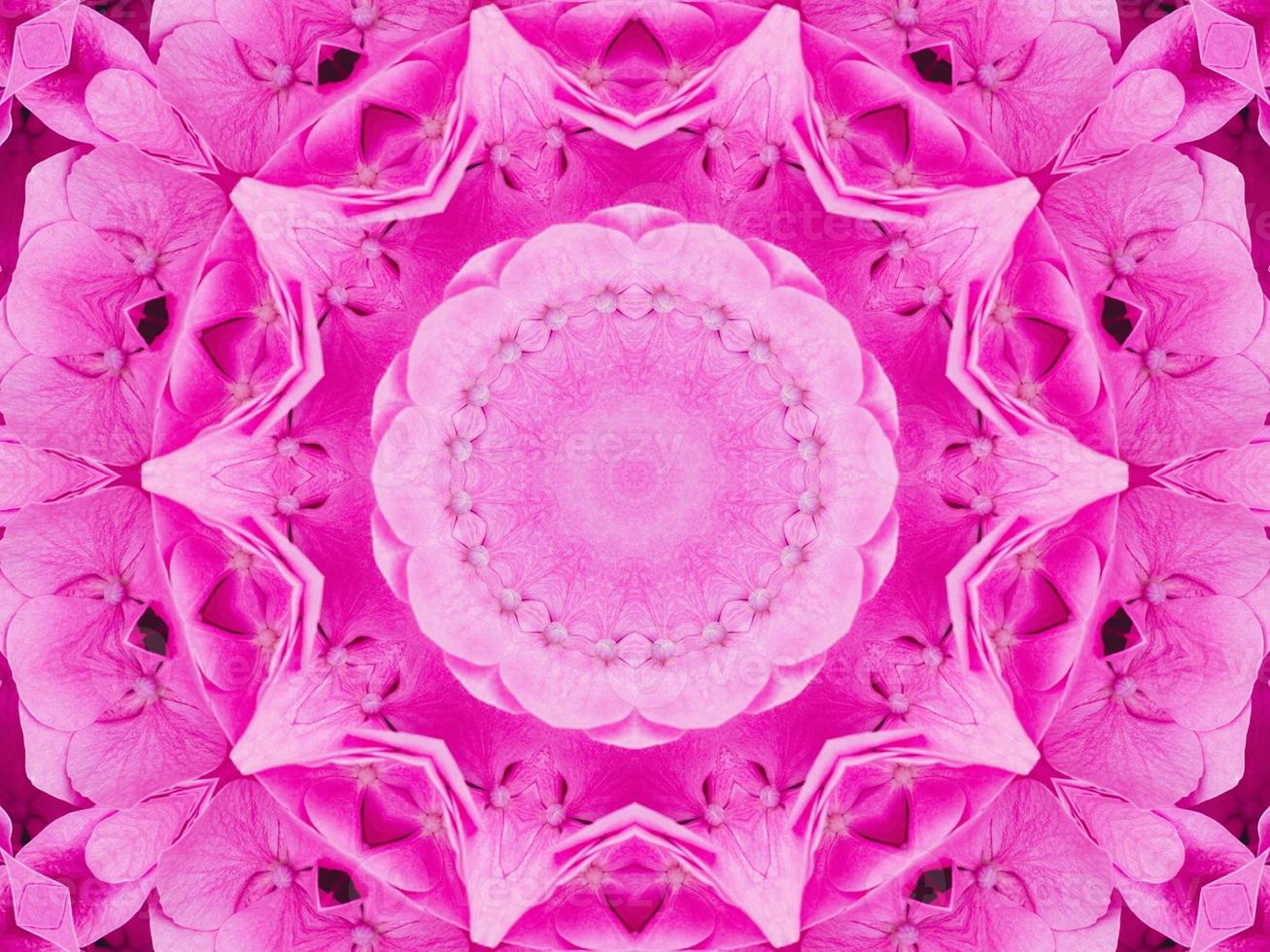 Magenta floral kaleidoscope pattern. Pink flower abstract unique and aesthetic background photo