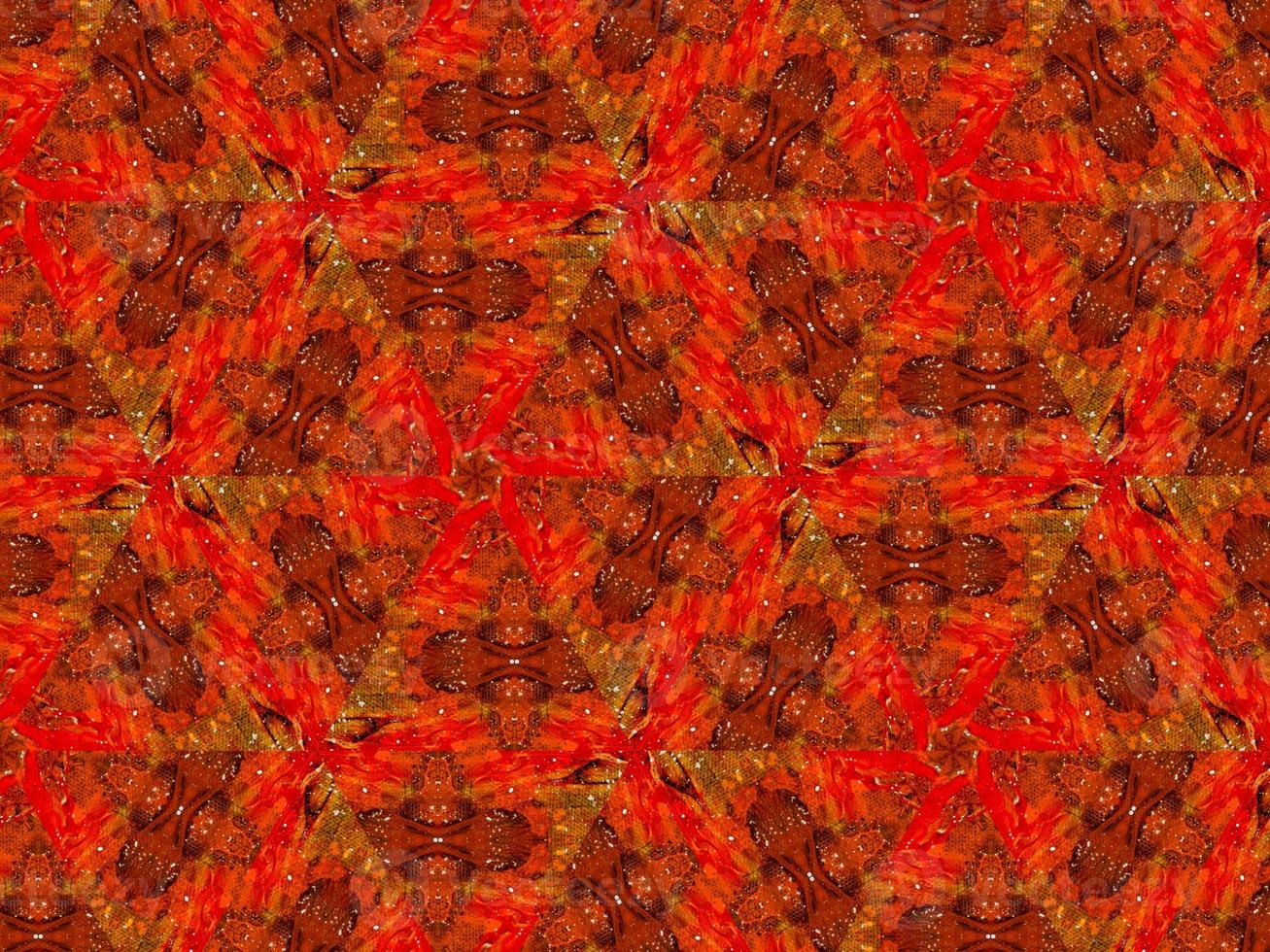 Colorful red fire kaleidoscope background abstract flower and symmetric pattern photo