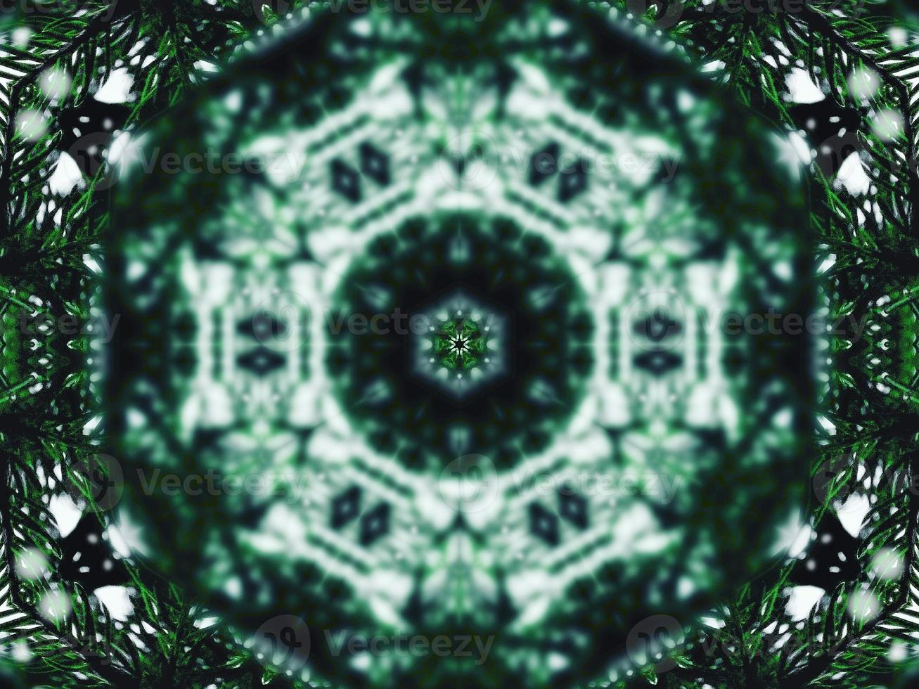 Blurry green leaves kaleidoscope background abstract flower and symmetric pattern for christmas vibes photo