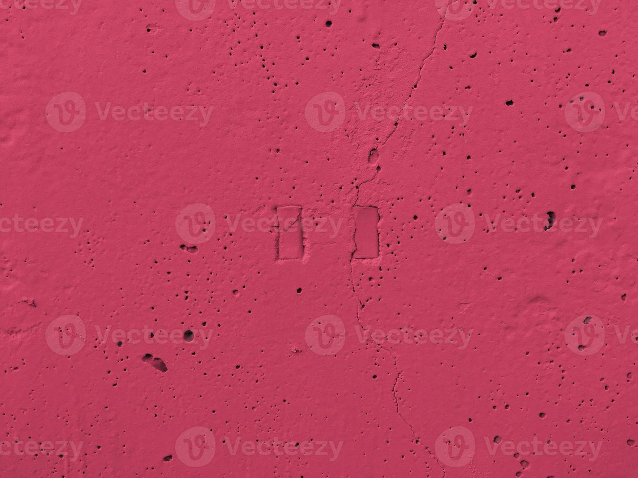 Depressions in the form of a pausa button. Viva Magenta wall, Pantone Color of the year 2023. Put your text here photo