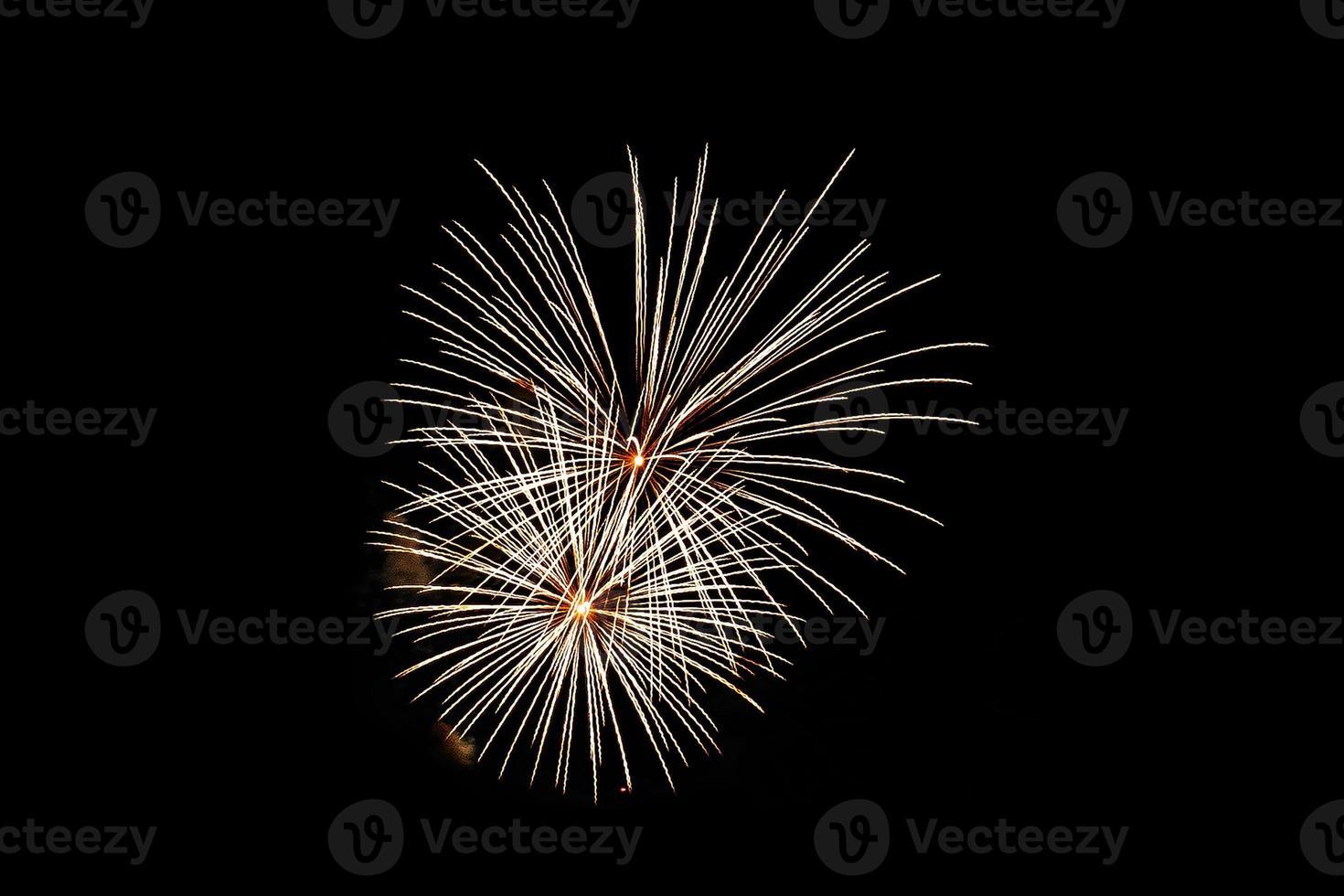 Abstract colored firework background light up the sky with dazzling display photo