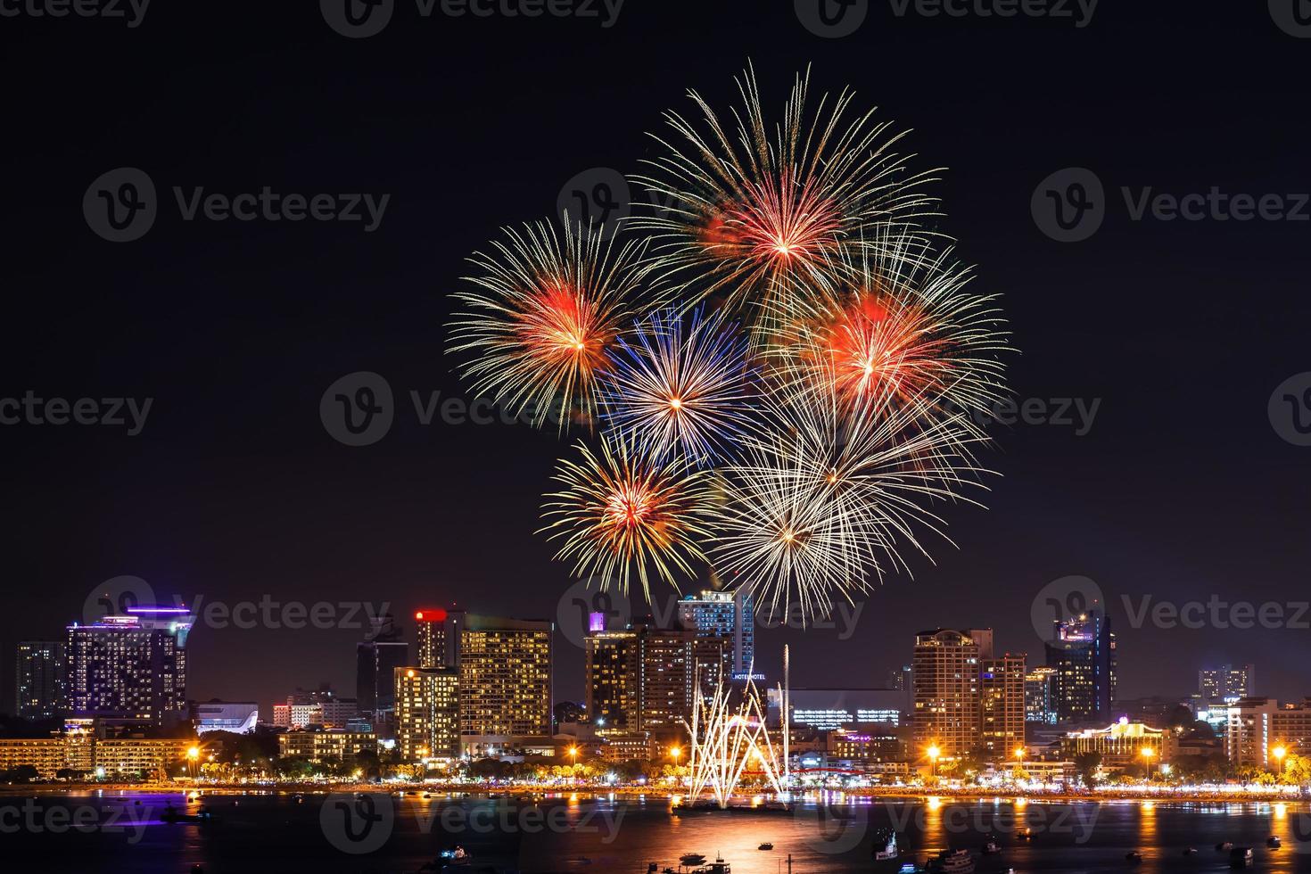 Abstract colored firework background light up the sky with dazzling display photo