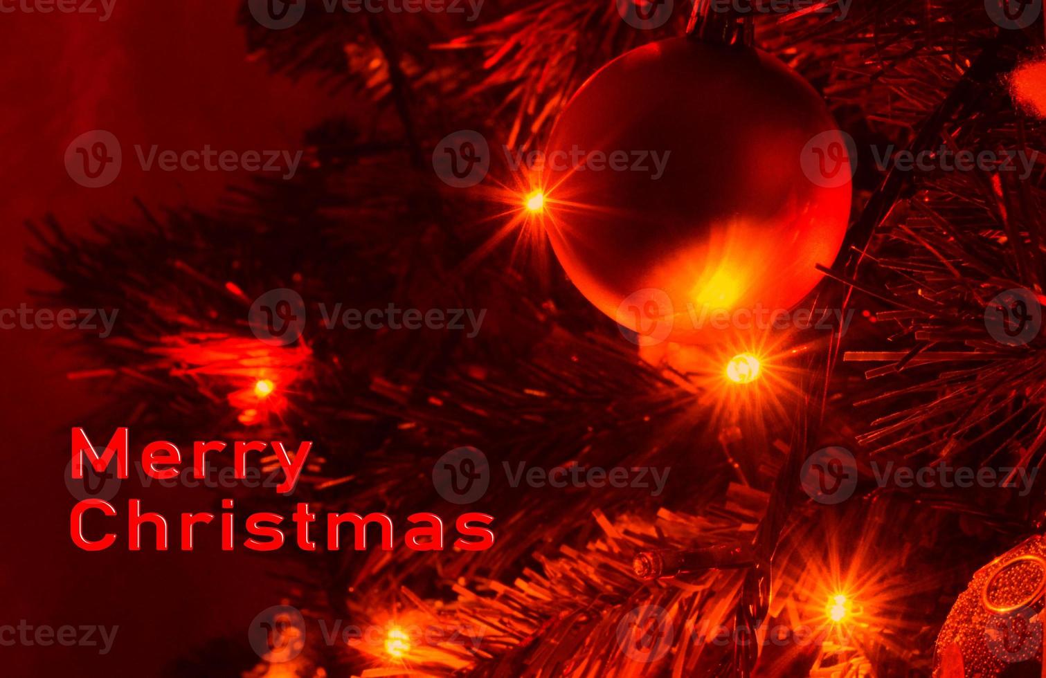 Decorated Christmas tree on a blurred background. Background from a decorated Christmas tree , Greeting card from a Christmas tree with decoration . photo
