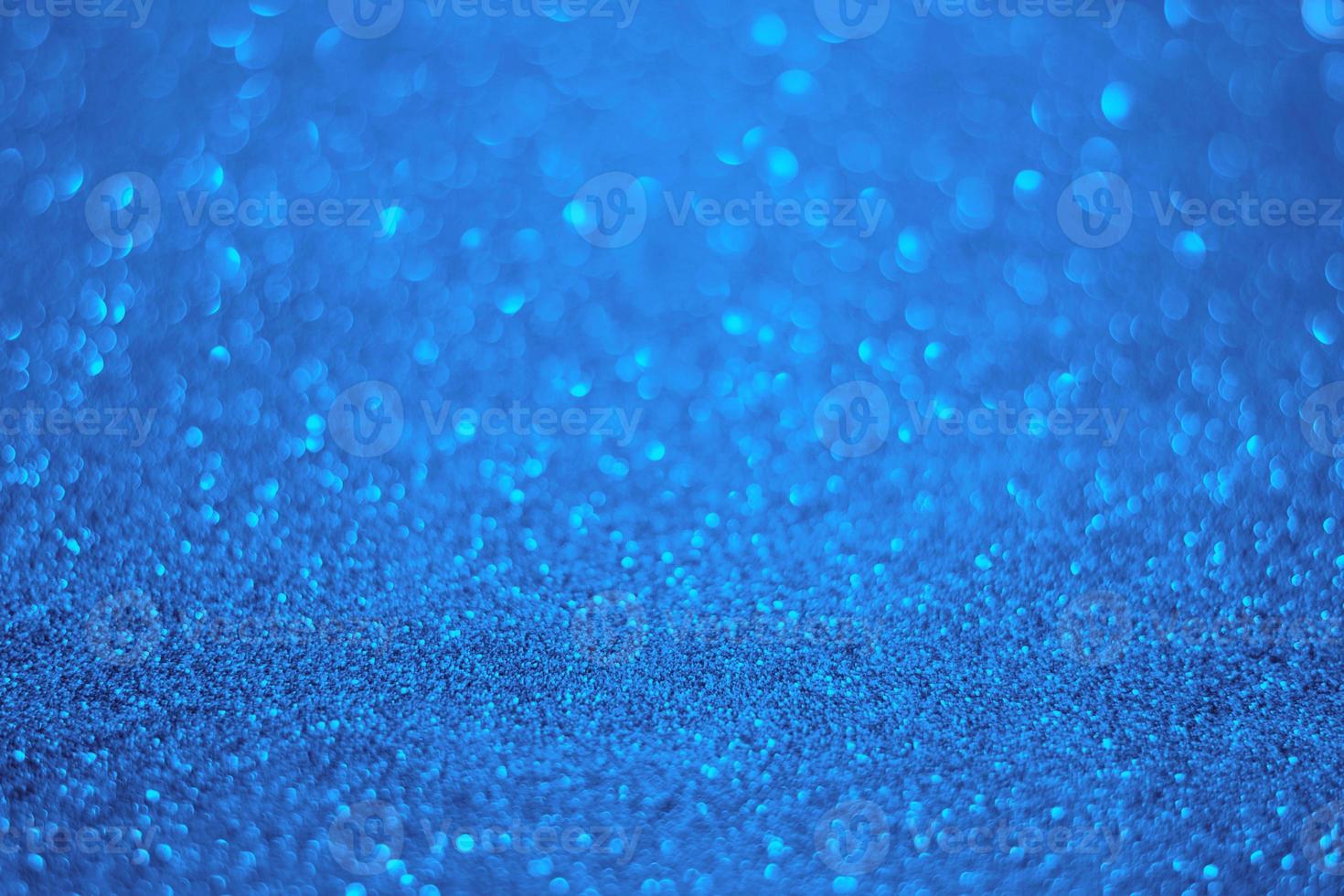 Light blue glitter background. Texture of light blue glitter particles