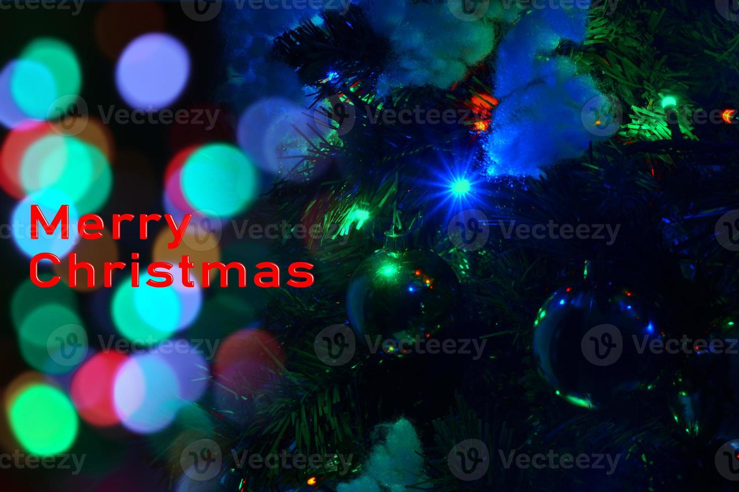 Decorated Christmas tree on a blurred background. Background from a decorated Christmas tree , Greeting card from a Christmas tree with decoration . photo