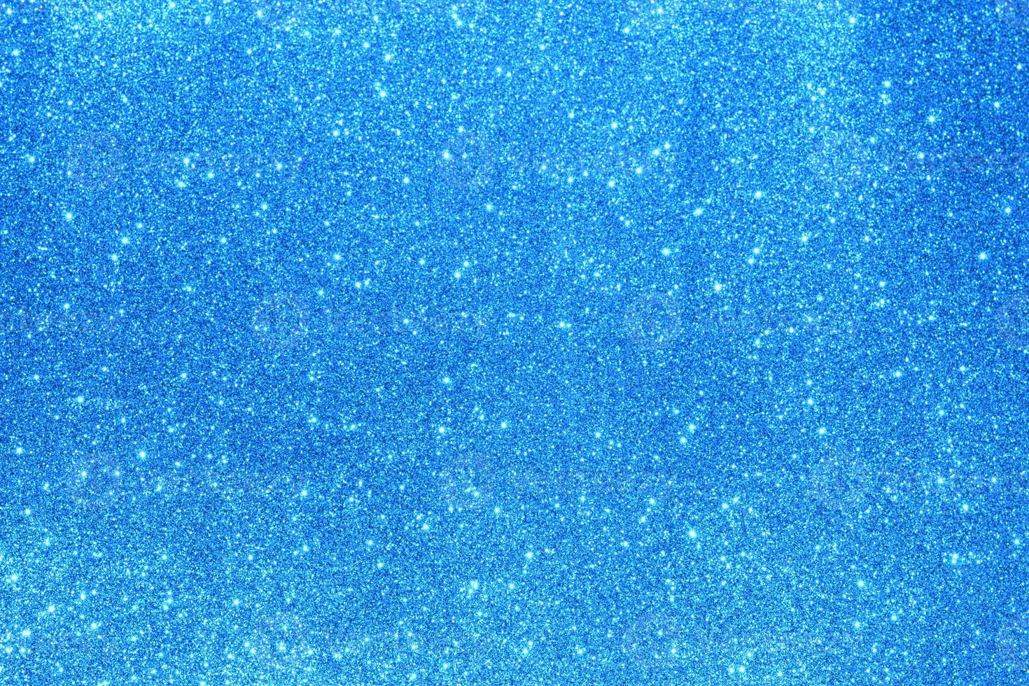 Light blue glitter background. Texture of light blue glitter particles