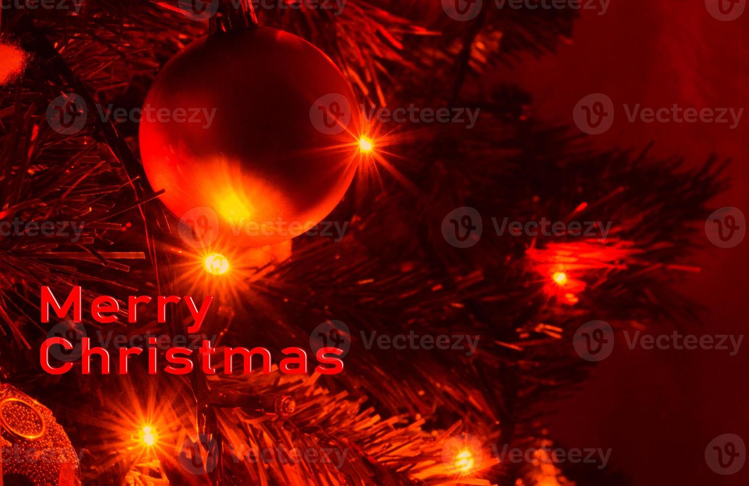 Decorated Christmas tree on a blurred background. Background from a decorated Christmas tree , Greeting card from a Christmas tree with decoration . photo