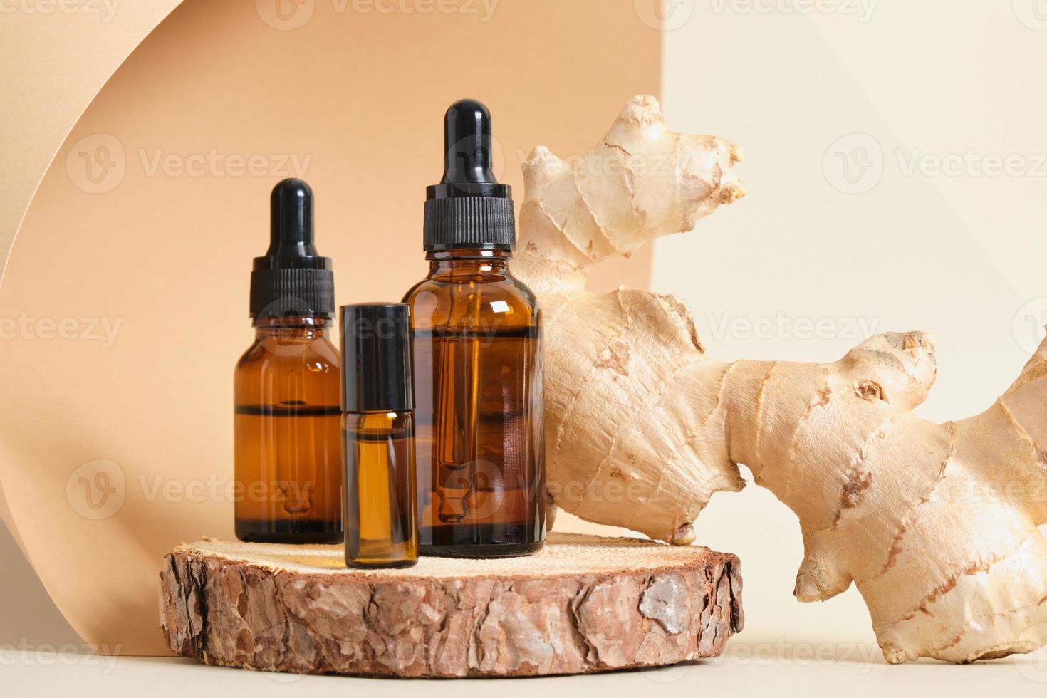 amber glass dropper bottles and ginger root on beige background copy space natural cosmetic concept photo