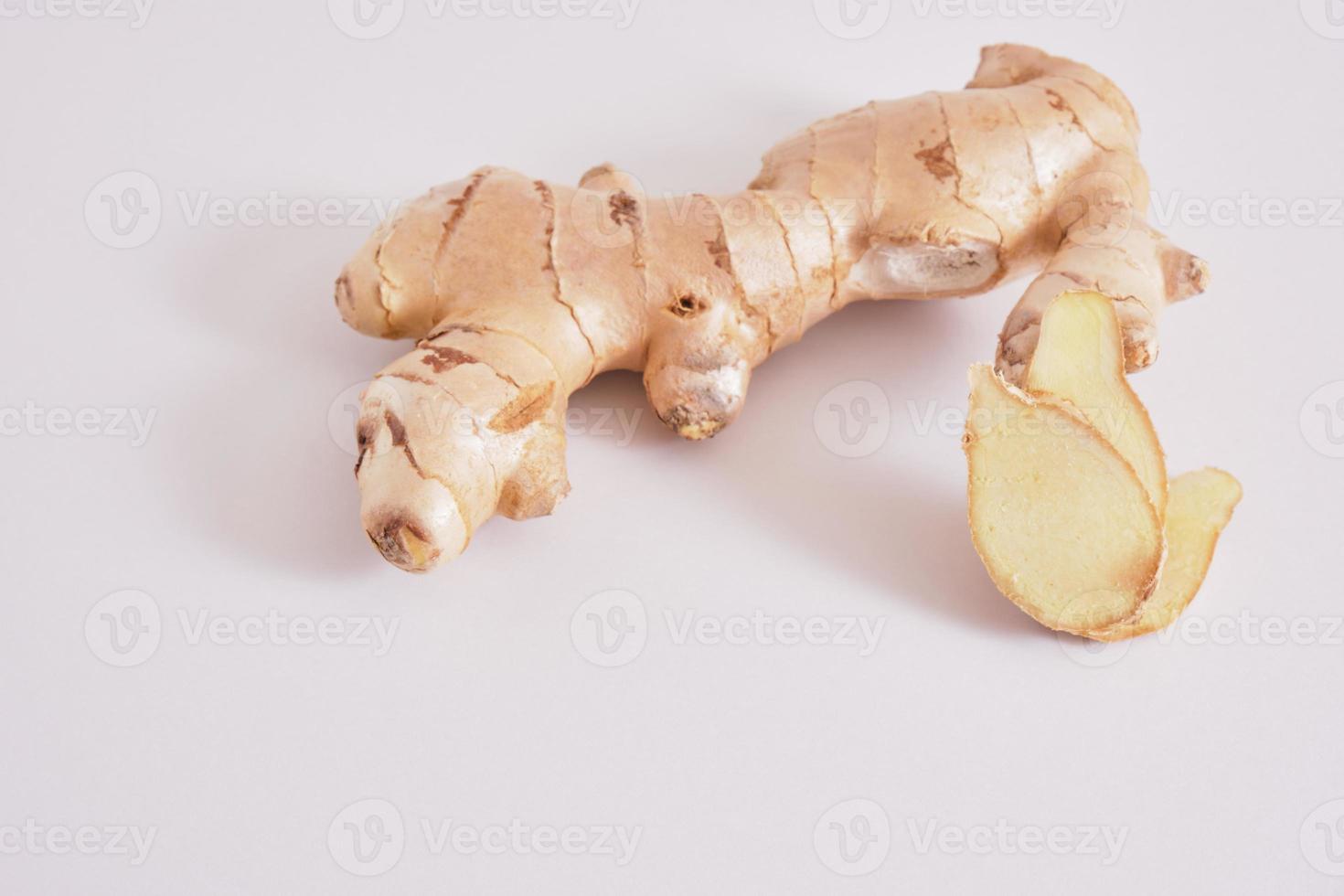 ginger on grey background copy space, ginger root and slices photo