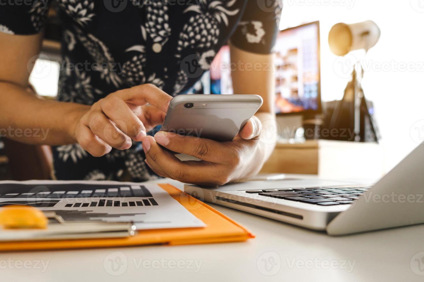 businessman hand using smart phone, tablet payments and holding credit card online shopping, omni channel, digital tablet docking keyboard computer at office in sun light photo