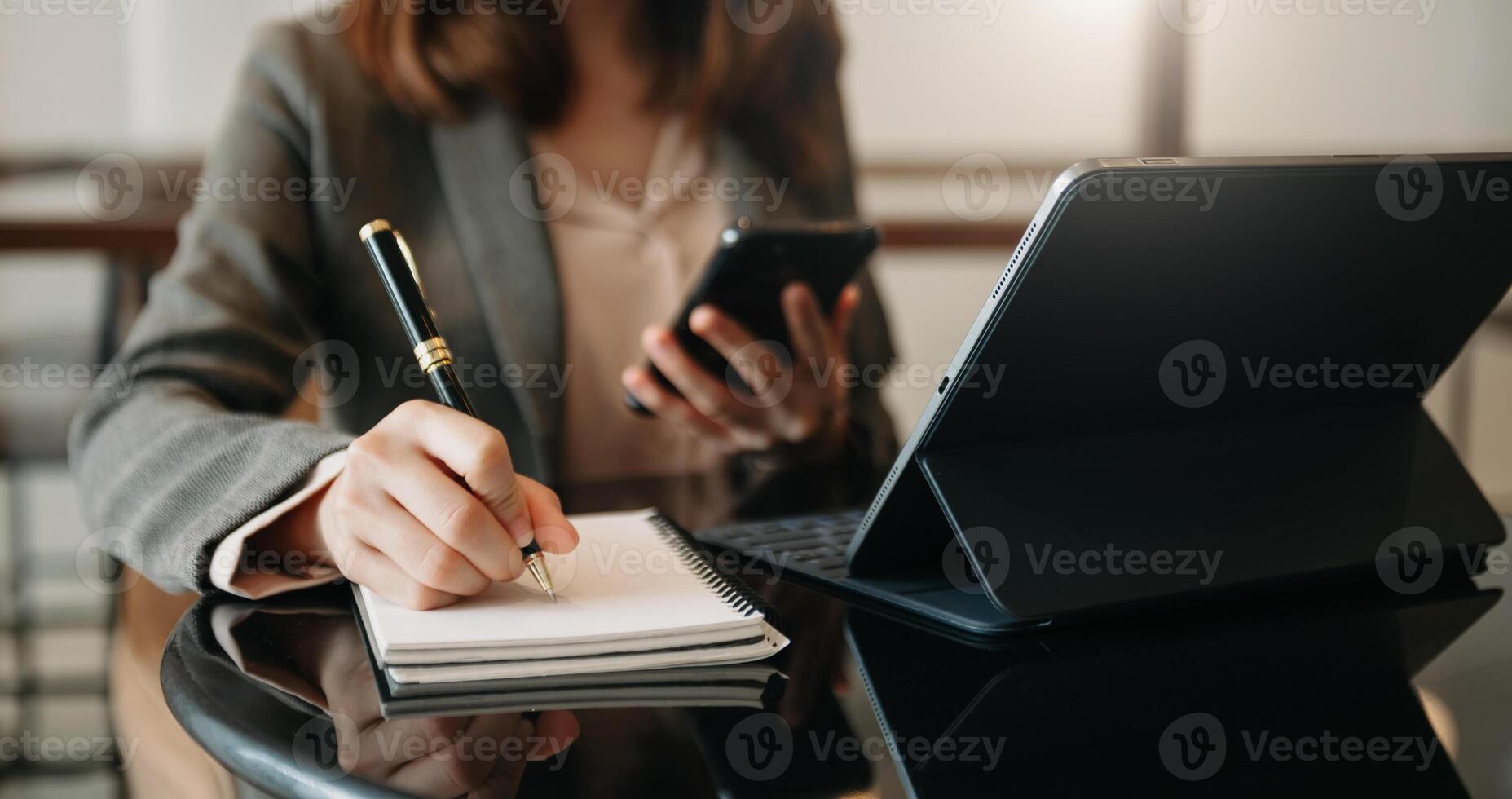 businesswoman hand working with new modern computer and writing on the notepad strategy diagram as concept photo