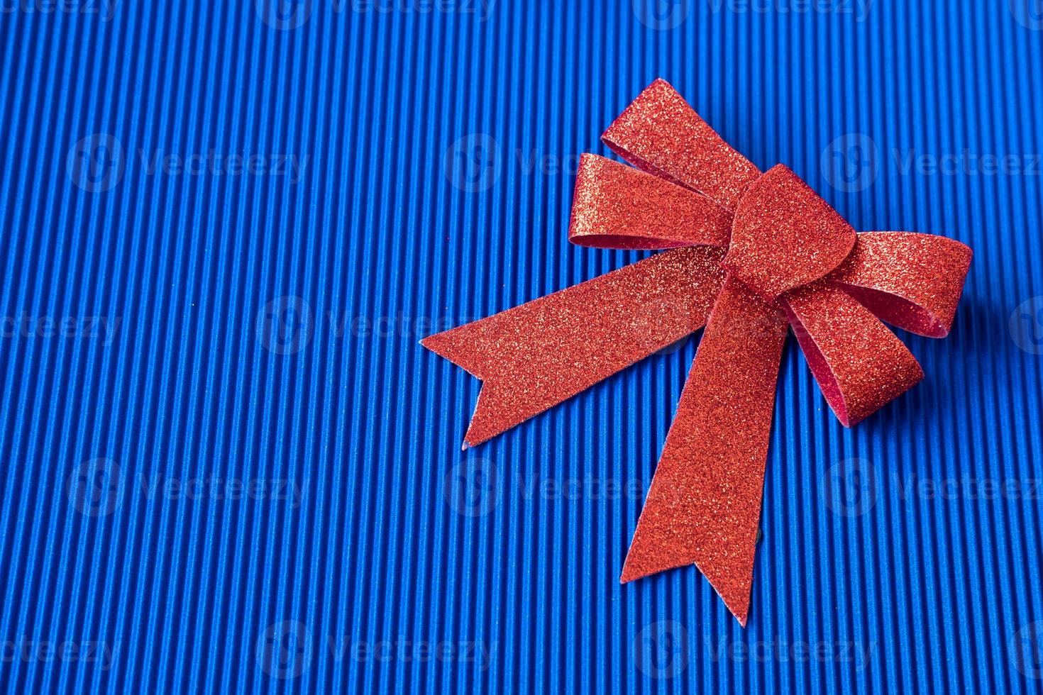 big red bow on a blue background, top viewcopy space photo