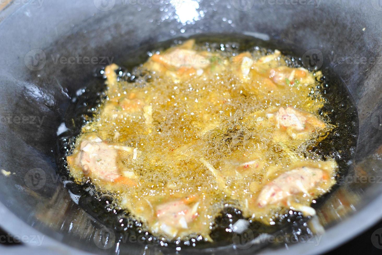 Closeup of frying bakwan on a frying pan. Typical traditional snacks of Asian Indonesian people. photo