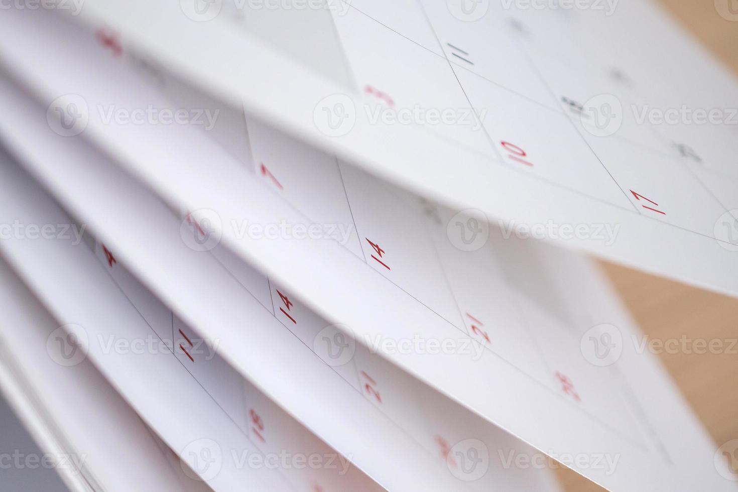Calendar page flipping sheet close up blur background business schedule planning appointment meeting concept photo