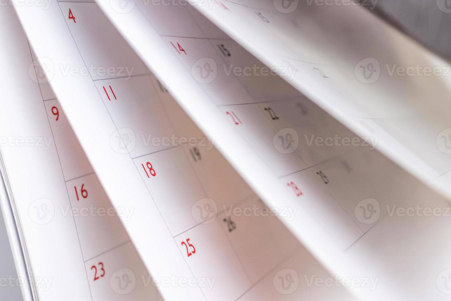 Calendar page flipping sheet close up blur background business schedule planning appointment meeting concept photo
