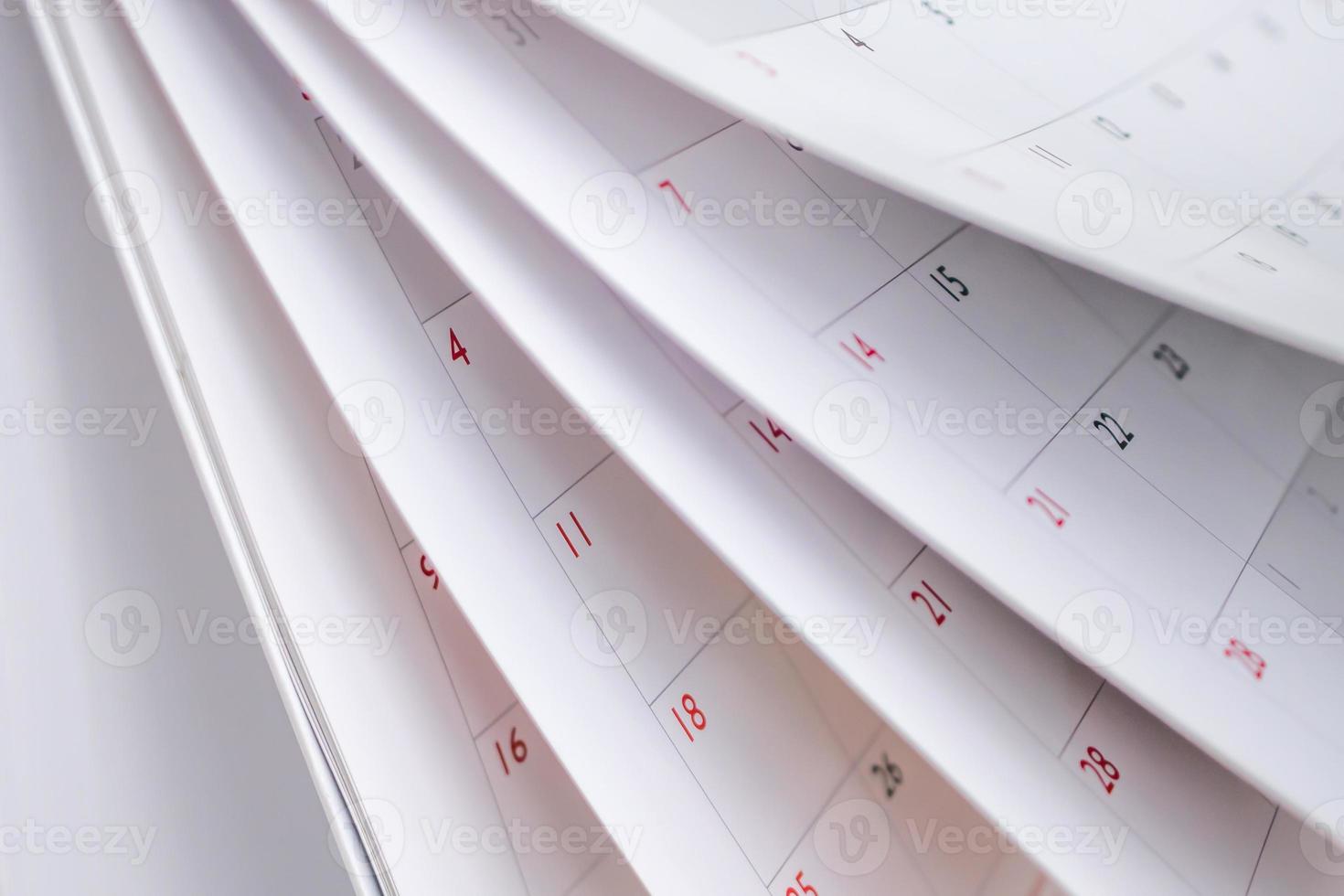 Calendar page flipping sheet close up blur background business schedule planning appointment meeting concept photo