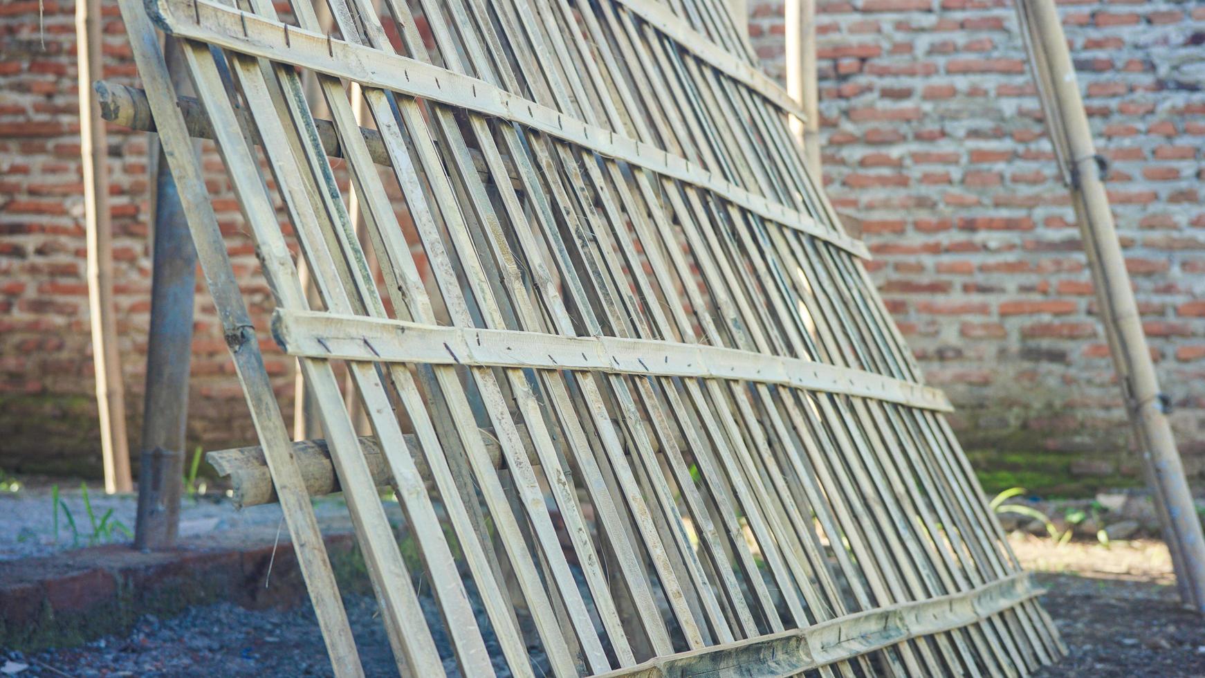 a bamboo is arranged and nailed to be used as a fence photo