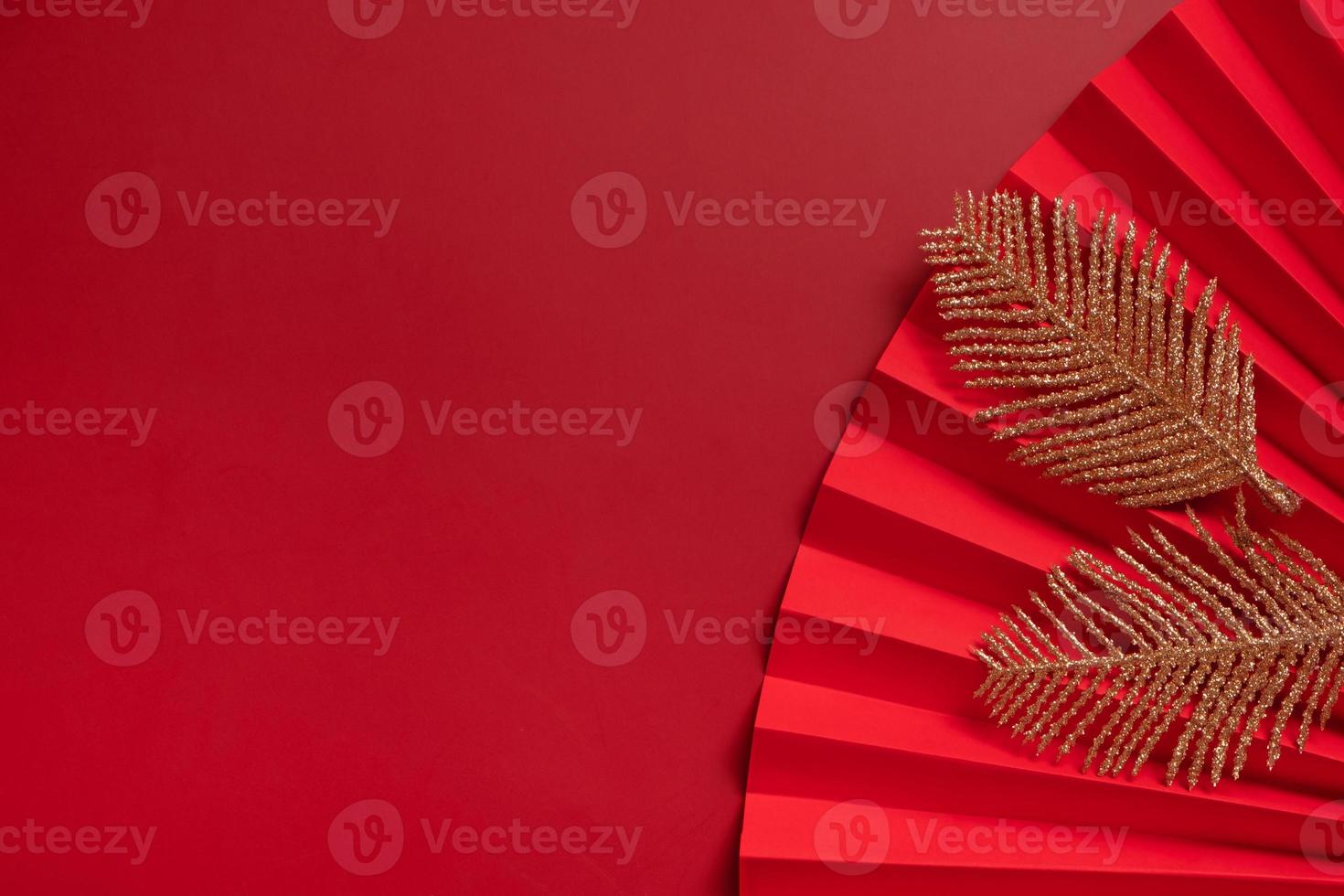 Paper fan and golden twigs symbol Chinese new year top view with copy space photo