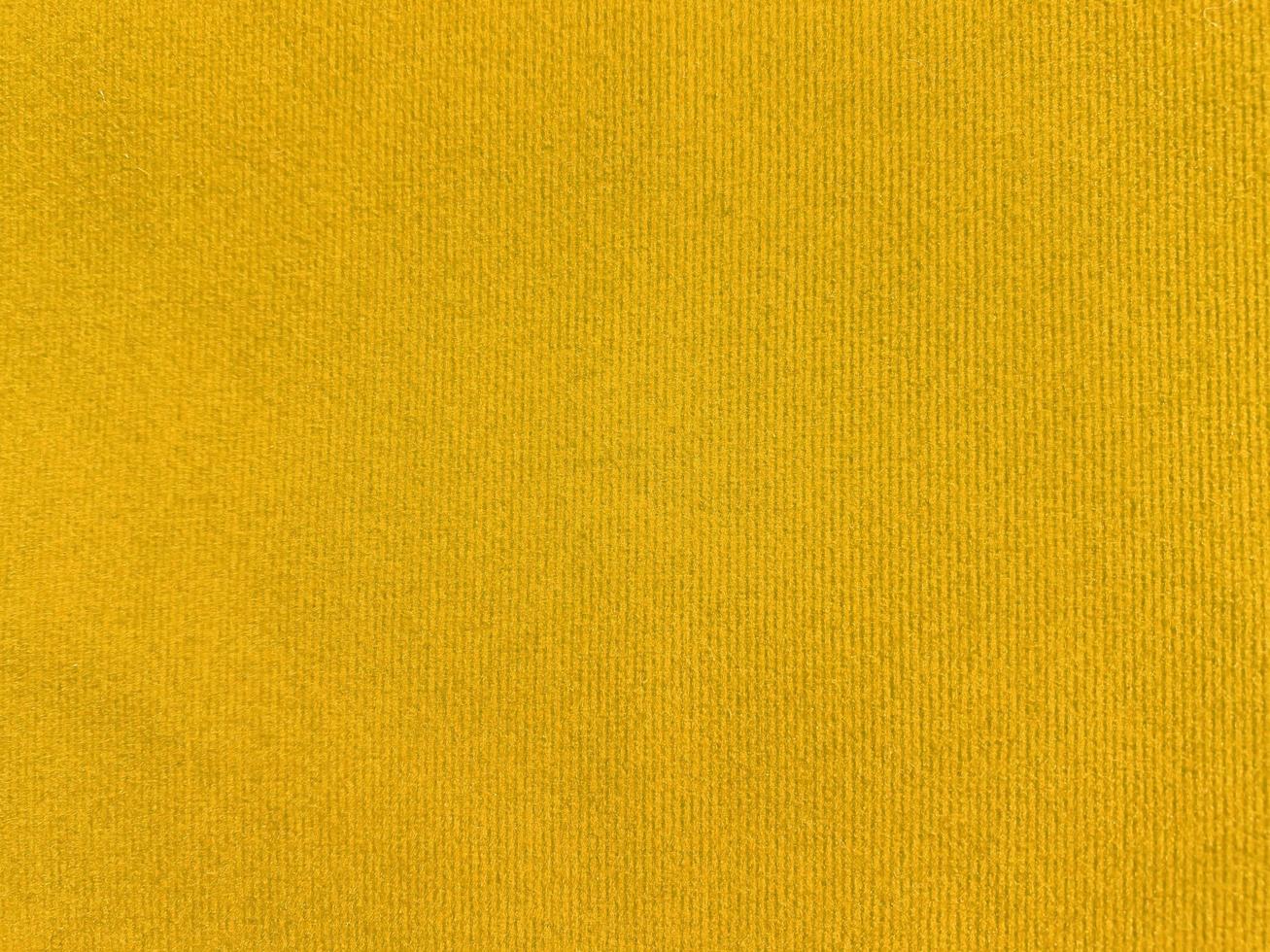 Yellow velvet fabric texture used as background. Empty yellow fabric background of soft and smooth textile material. There is space for text. photo
