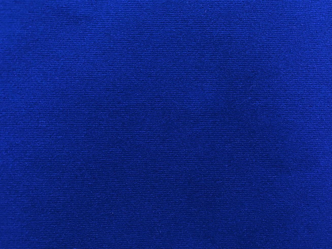 Blue  velvet fabric texture used as background. Empty blue fabric background of soft and smooth textile material. There is space for text. photo