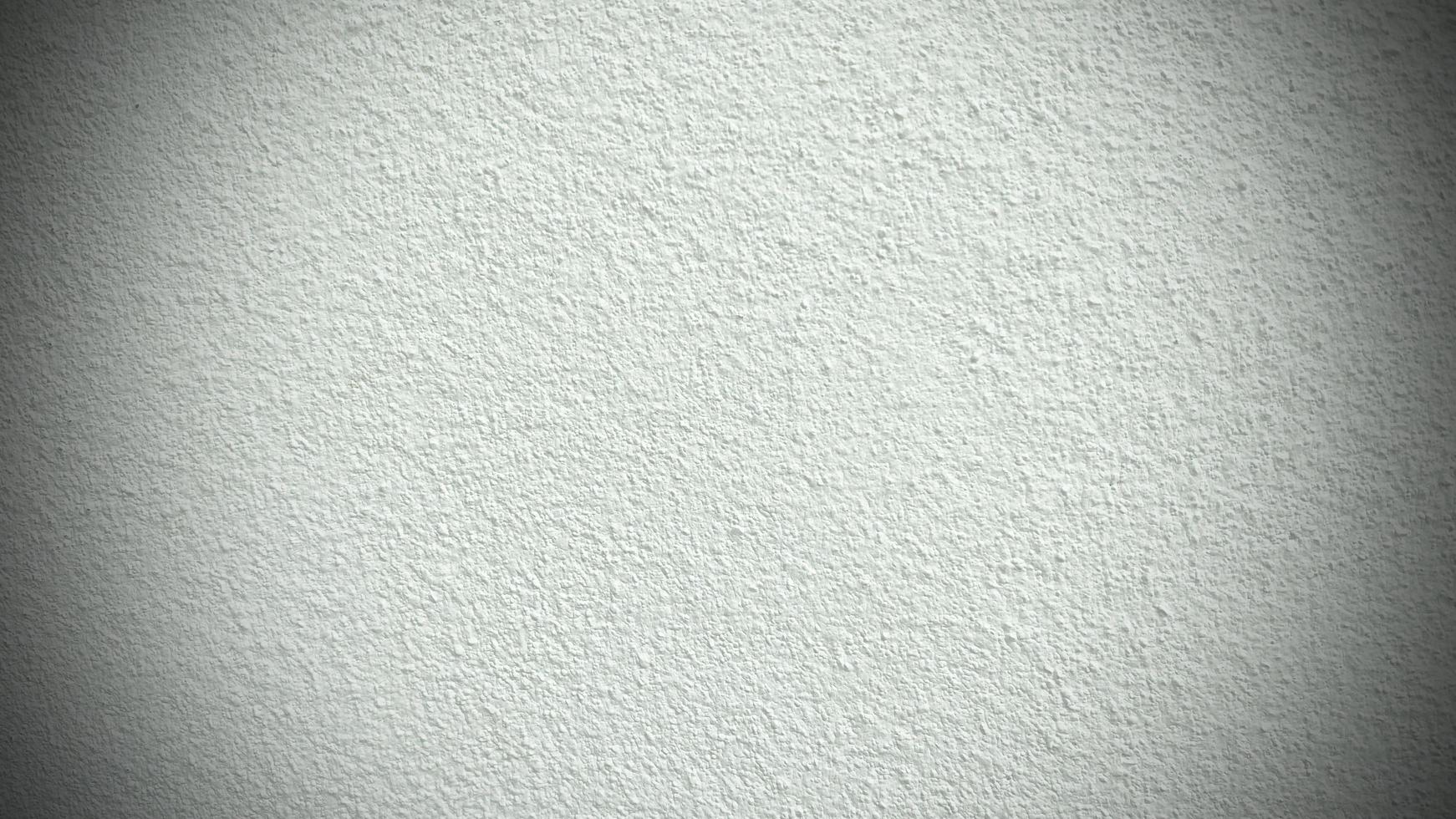 Seamless texture of white cement wall a rough surface, with space for text, for a background. Ready to use vignette. photo