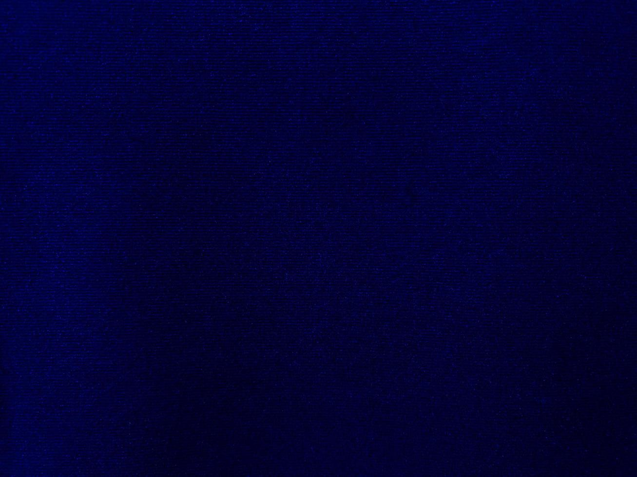 Dark blue velvet fabric texture used as background. Empty dark blue fabric background of soft and smooth textile material. There is space for text. photo
