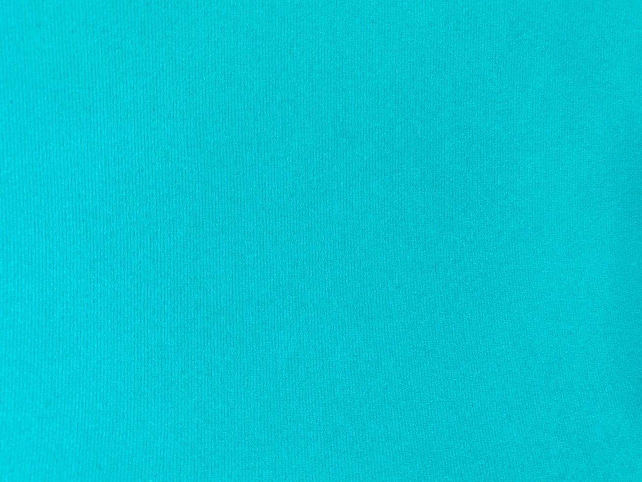 Turquoise velvet fabric texture used as background. Empty turquoise fabric background of soft and smooth textile material. There is space for text. photo