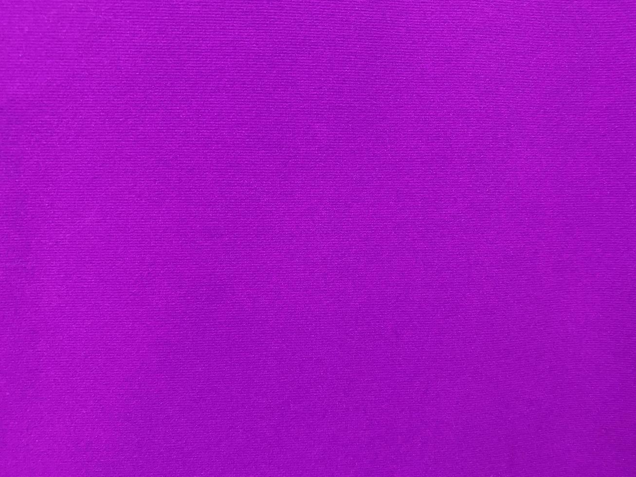 Dark purple old velvet fabric texture used as background. Empty purple fabric background of soft and smooth textile material. There is space for text.... photo