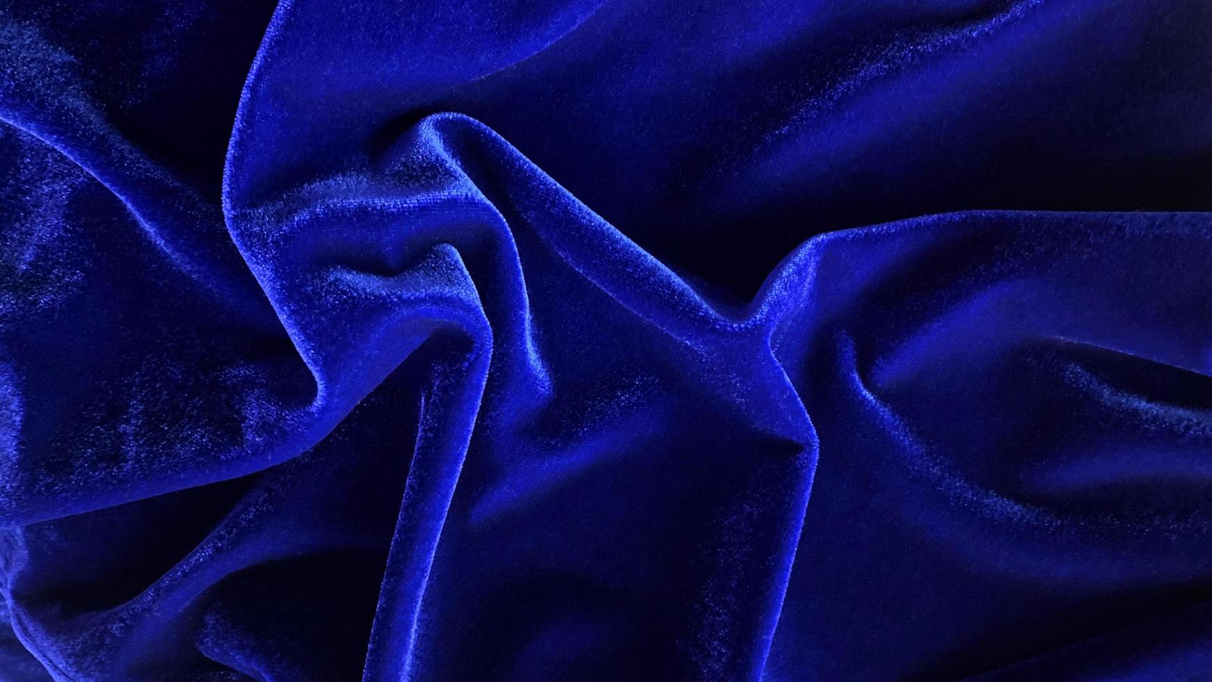 Blue velvet fabric texture used as background. Empty Bluefabric background of soft and smooth textile material. There is space for text. photo