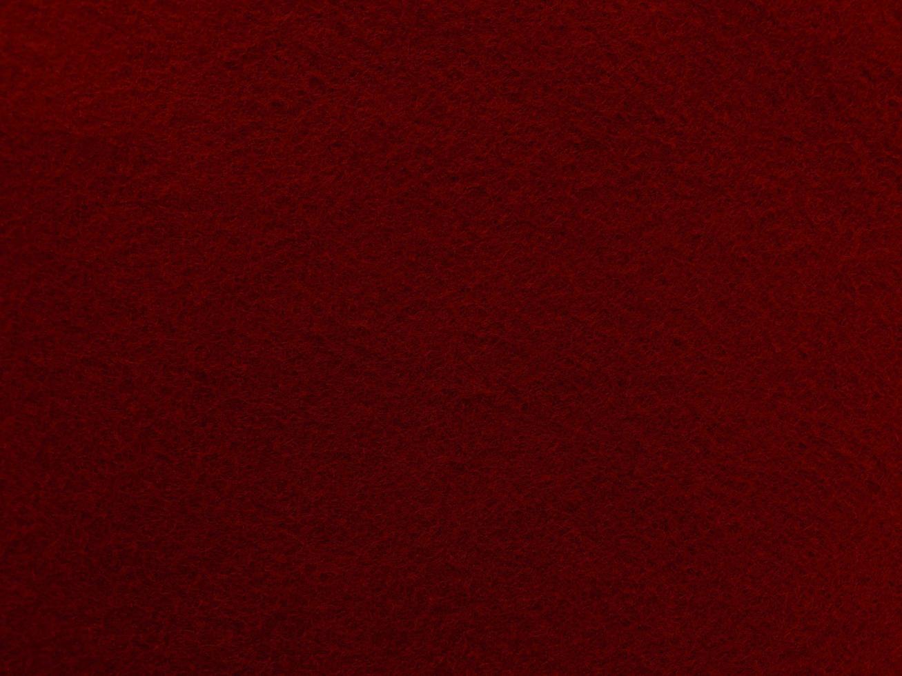 Felt dark red soft rough textile material background texture close up,poker table,tennis ball,table cloth. Empty new fabric background. photo