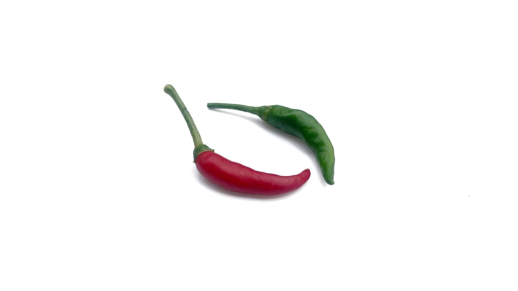 Fresh red and green chili peppers placed on a white background, great for editing and advertising spicy foods. photo