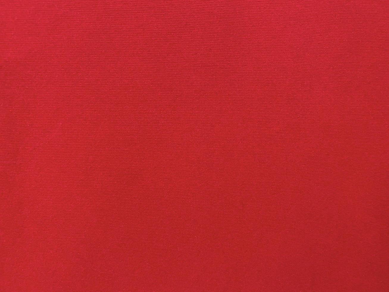 Dark red velvet fabric texture used as background. Empty dark red fabric background of soft and smooth textile material. There is space for text. photo